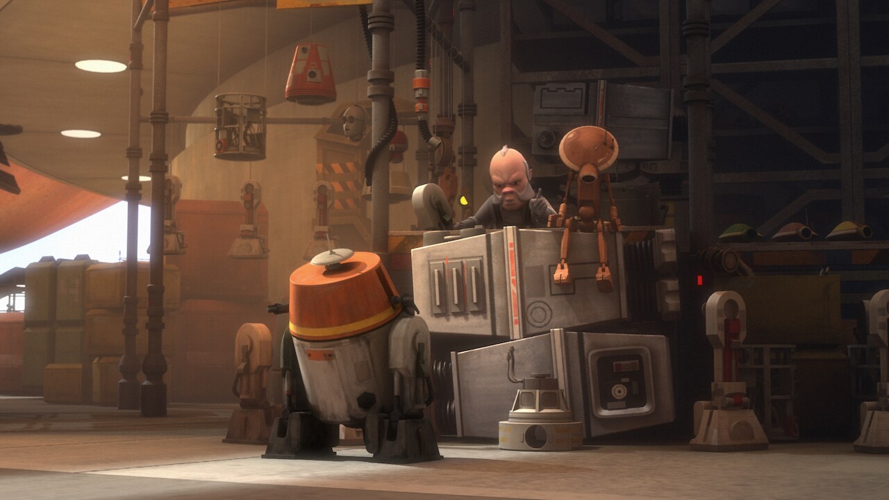 Among the items in the Ugnaught’s wares are astromech body frames, astromech heads, protocol droi...