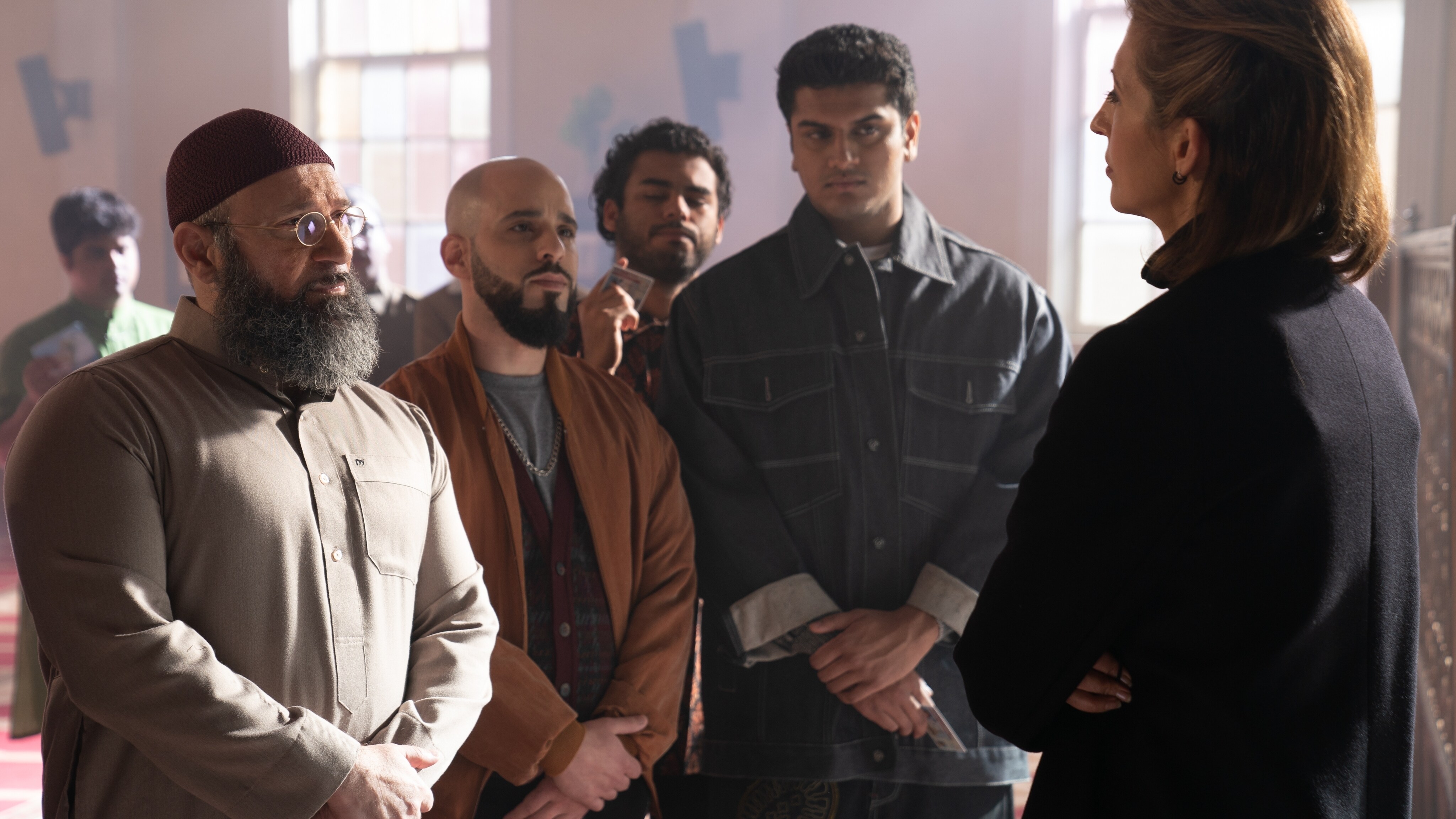 (Far left): Laith Nakli as Sheikh Abdallah, and (Far right): Alysia Reiner as Agent Sadie Deever in Marvel Studios' MS. MARVEL. Photo by Daniel McFadden. ©Marvel Studios 2022. All Rights Reserved.