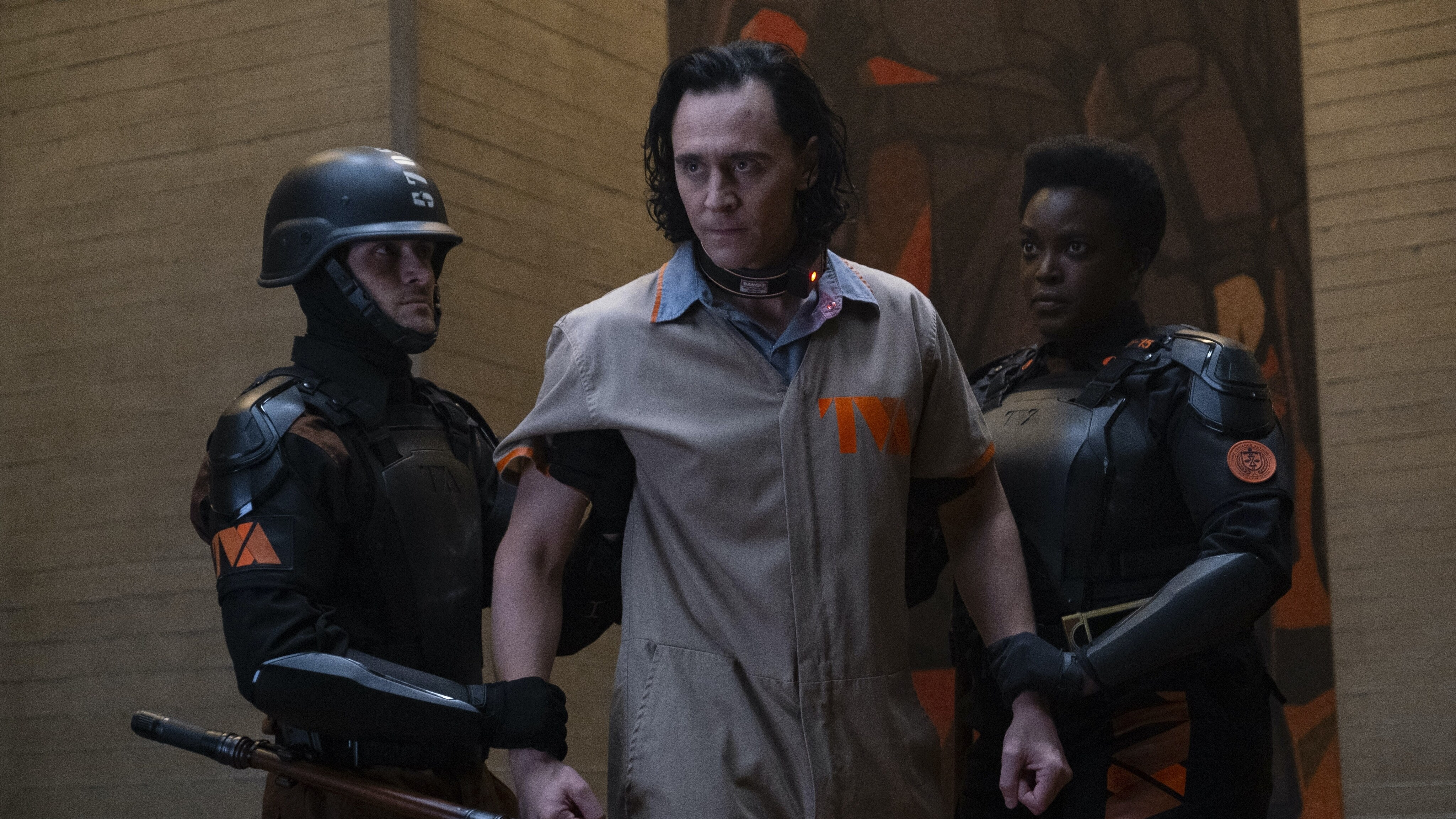 (L-R): Loki (Tom Hiddleston) and Hunter B-15 (Wunmi Mosaku) in Marvel Studios' LOKI exclusively on Disney+. Photo by Chuck Zlotnick. ©Marvel Studios 2021. All Rights Reserved.