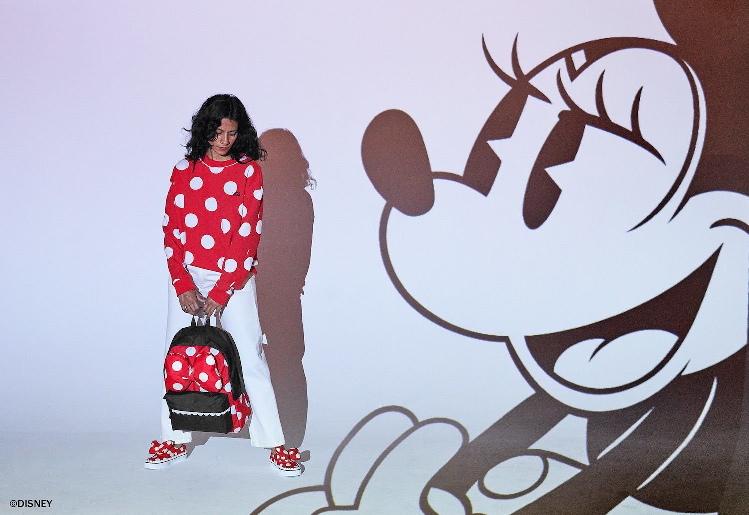 Minnie Mouse sweatshirt, back pack and shoes from the Vans x Disney collection