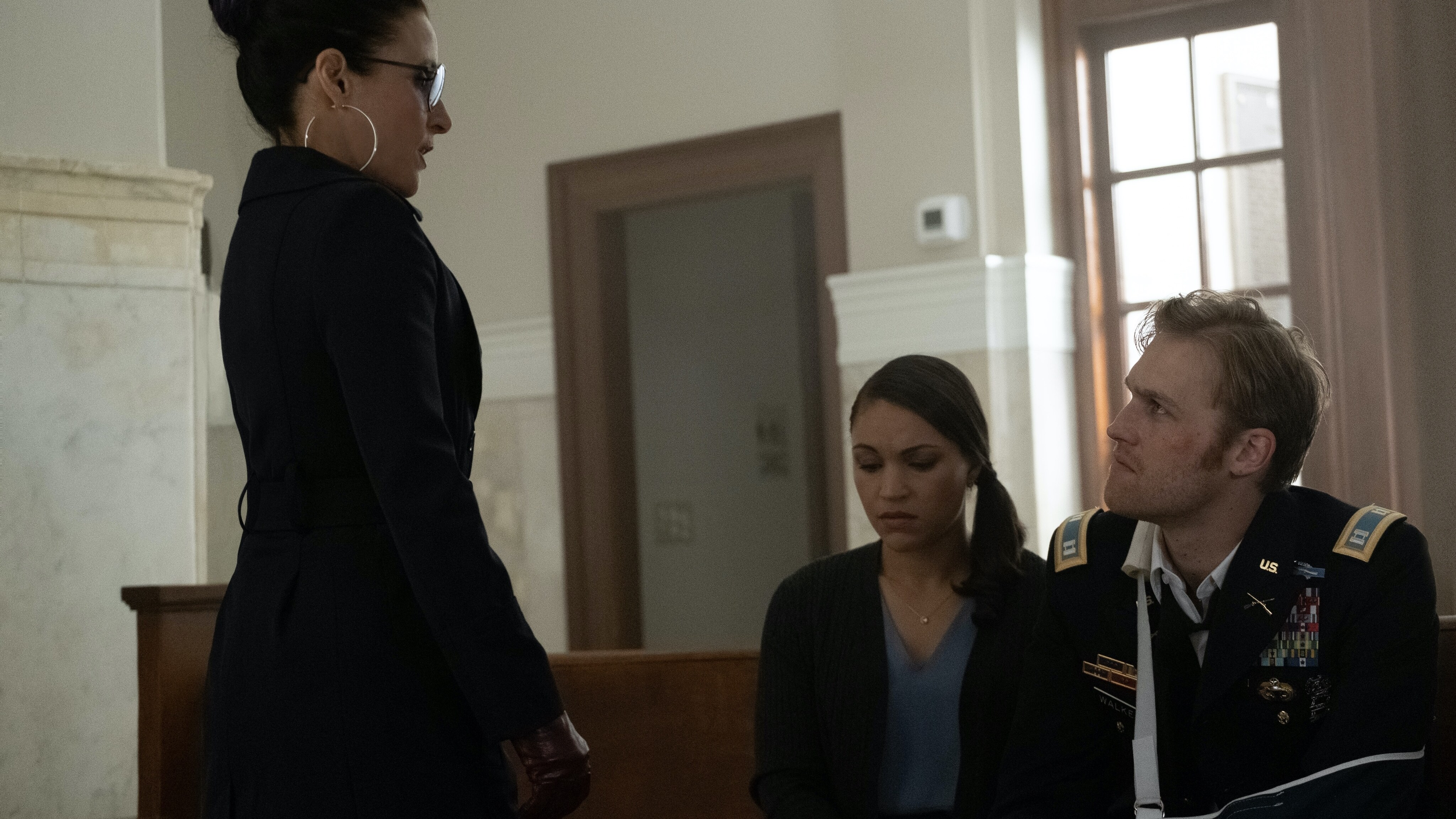 (L-R): Valentina Allegra DeFontaine (Julia Louis-Dreyfuss), Olivia Walker (Gabrielle Byndloss) and John Walker (Wyatt Russell) in Marvel Studios' THE FALCON AND THE WINTER SOLDIER exclusively on Disney+. Photo by Chuck Zlotnick. ©Marvel Studios 2021. All Rights Reserved.