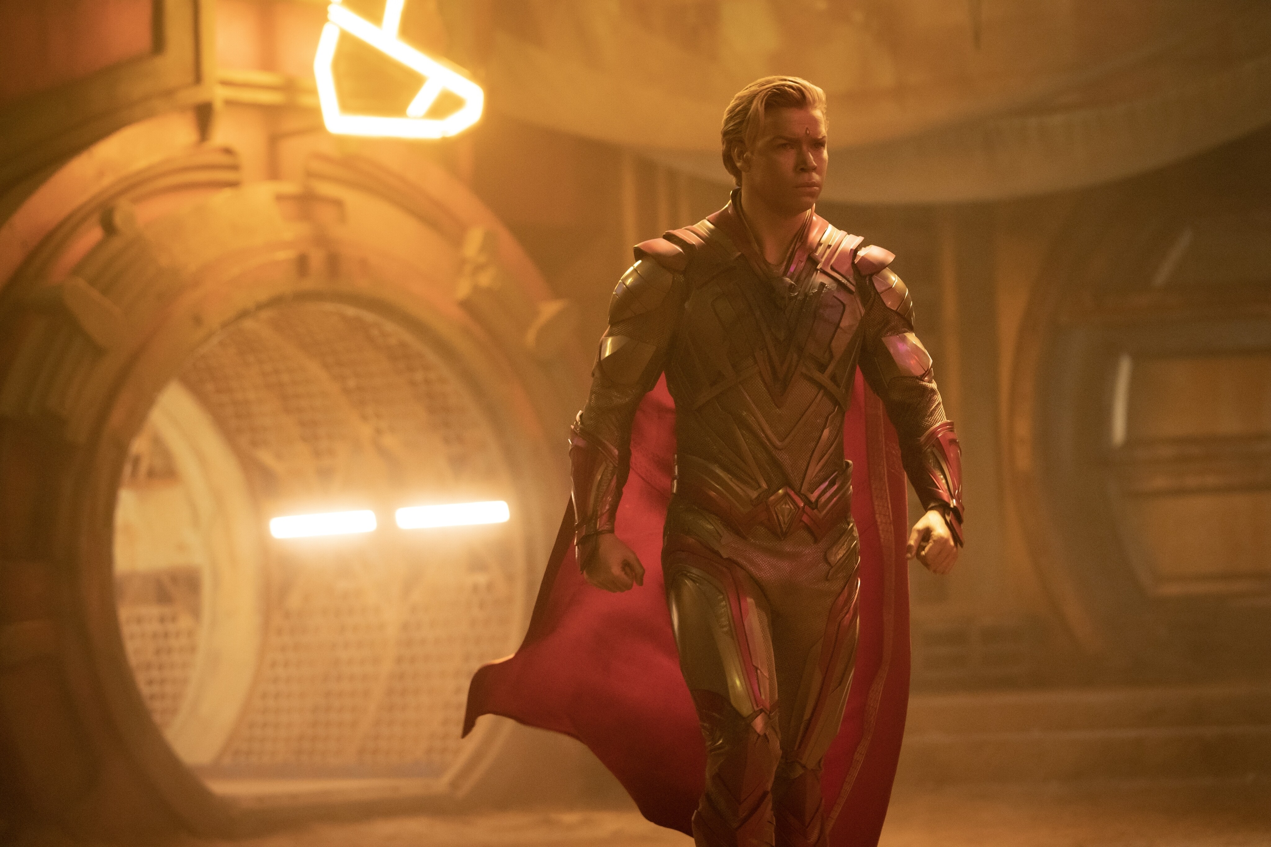 Adam Warlock (Will Poulter) strides forward, cape flowing behind him