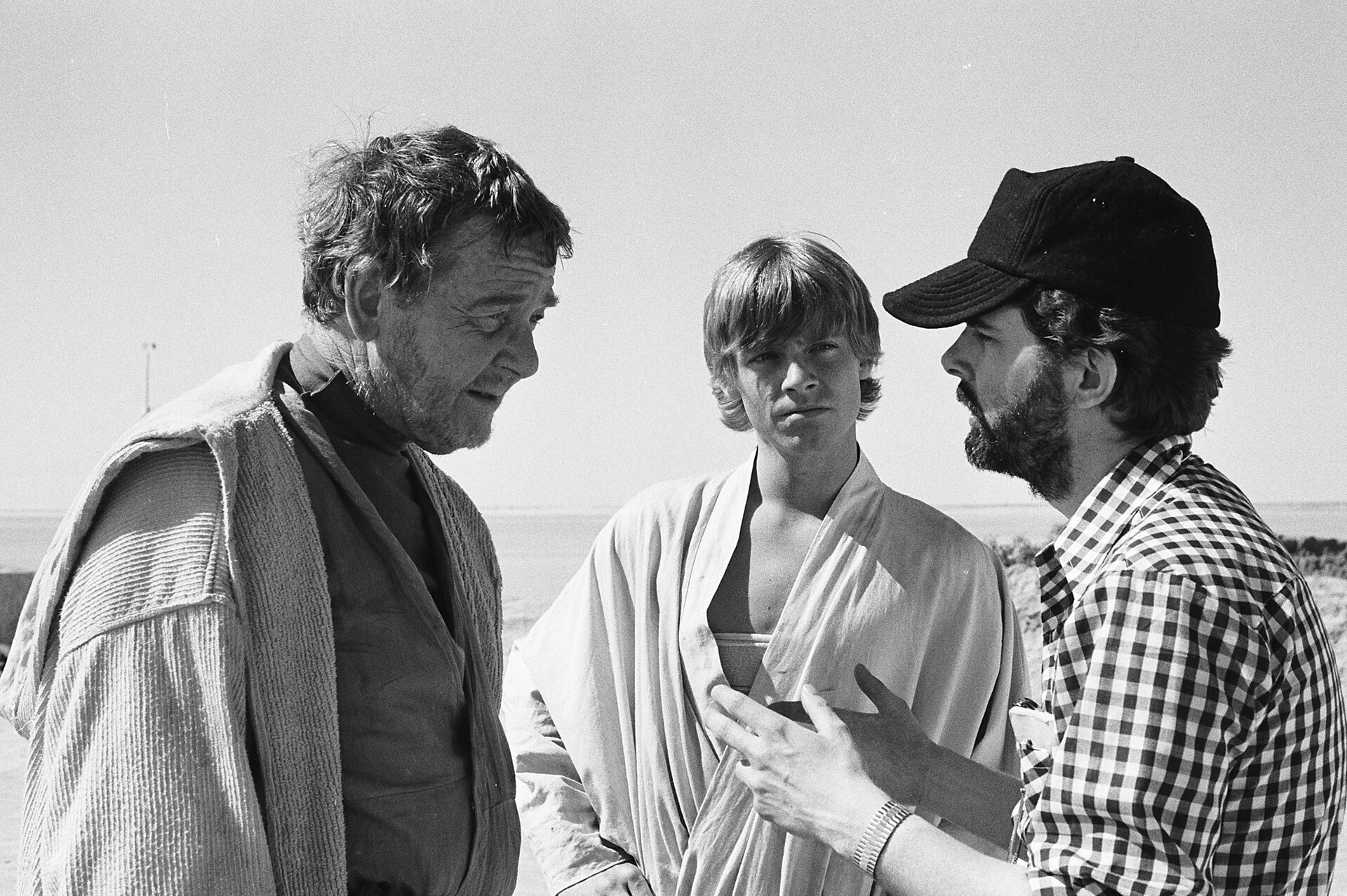 George Lucas (right) confers with Phil Brown (left) and Mark Hamill on the first day of shooting.