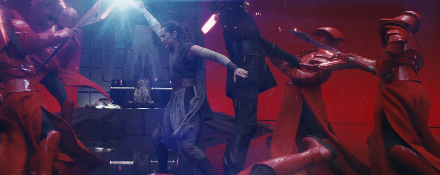 Rey and Kylo Ren fight off PraetorianGuards.