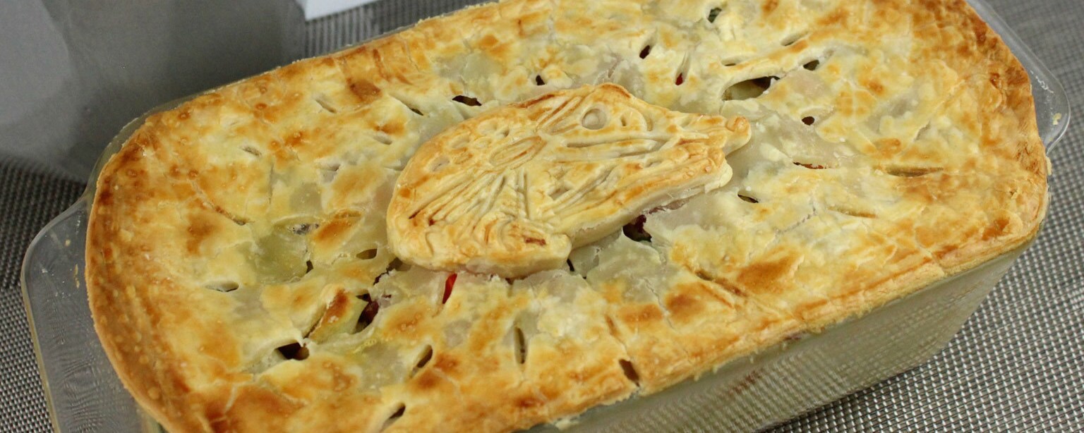 A baked Ham Solo pot pie, topped with a dough Millennium Falcon.