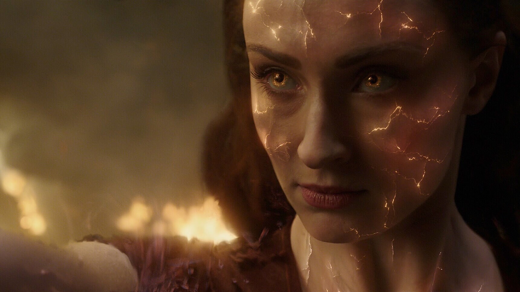 Actor Sophie Turner (as Jean Grey/Phoenix)face glowing in the movie "X-Men: Dark Phoenix"