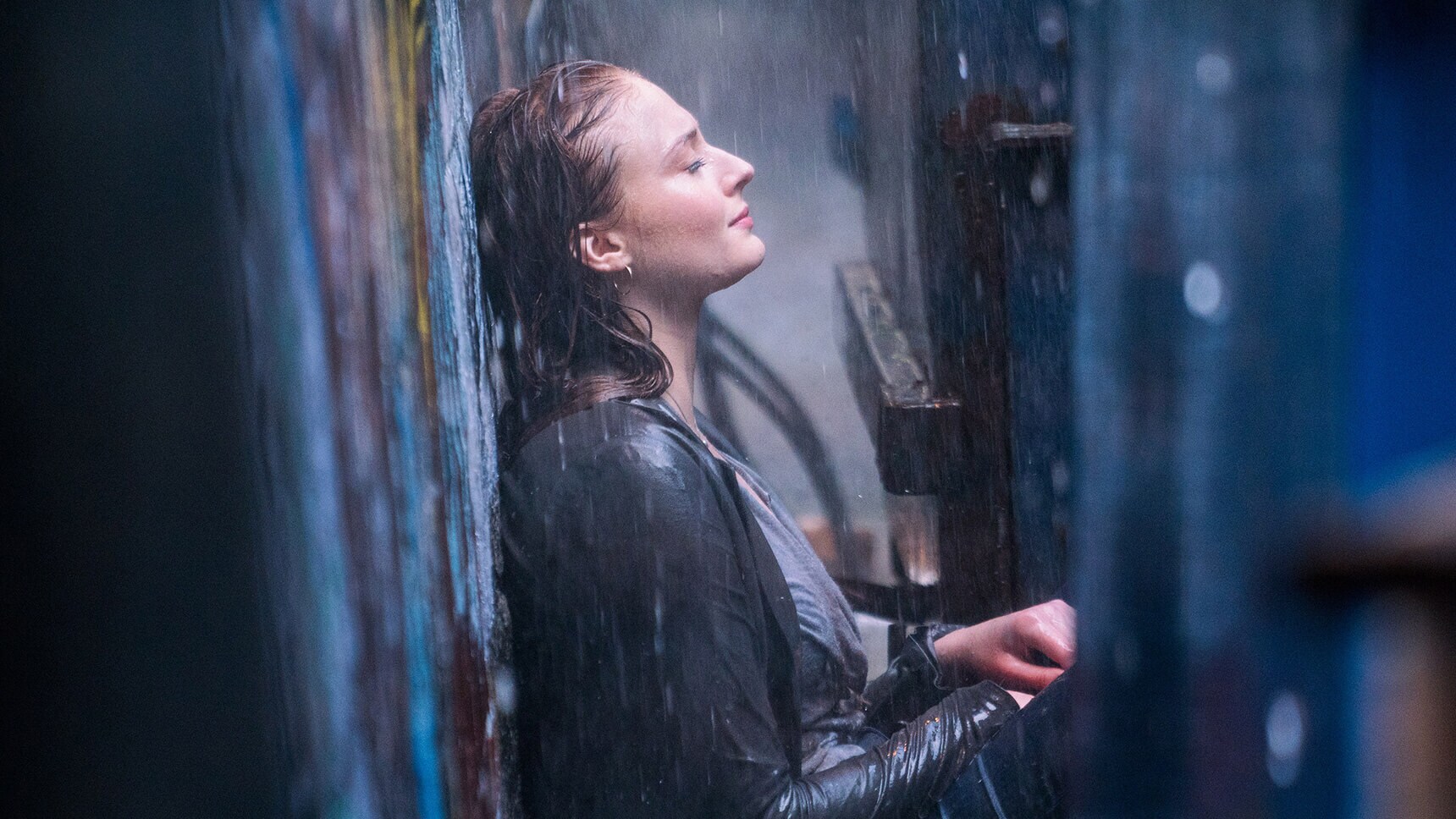 Actor Sophie Turner (as Jean Grey/Phoenix) sitting in the rain in the movie "X-Men: Dark Phoenix"