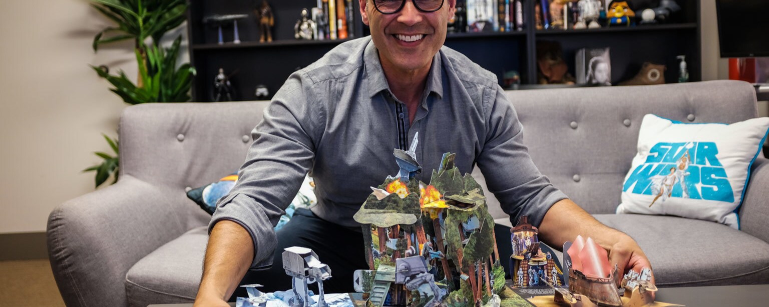Matthew Reinhart, author and pop-up book artist, with his pop-up book Star Wars: The Ultimate Pop-Up Galaxy.