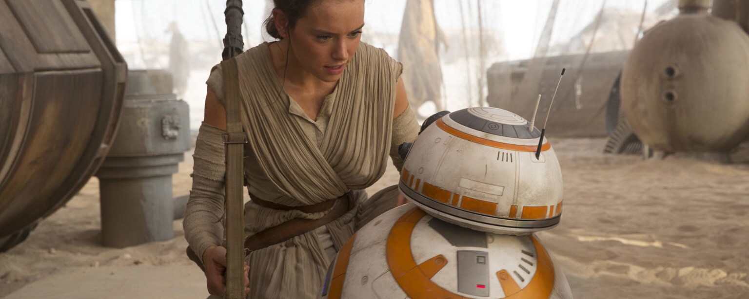 Rey talks to BB-8 in a scene from The Force Awakens.