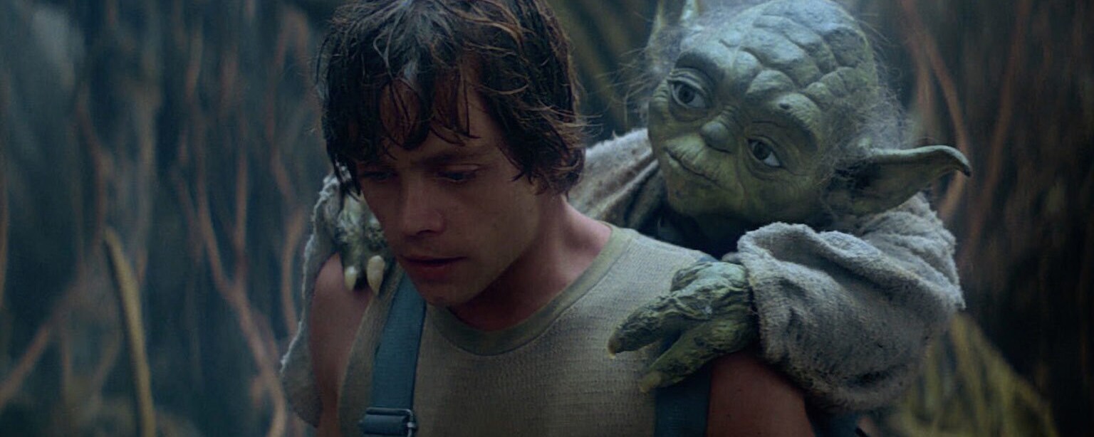 Yoda rides on Luke's back in The Empire Strikes Back.