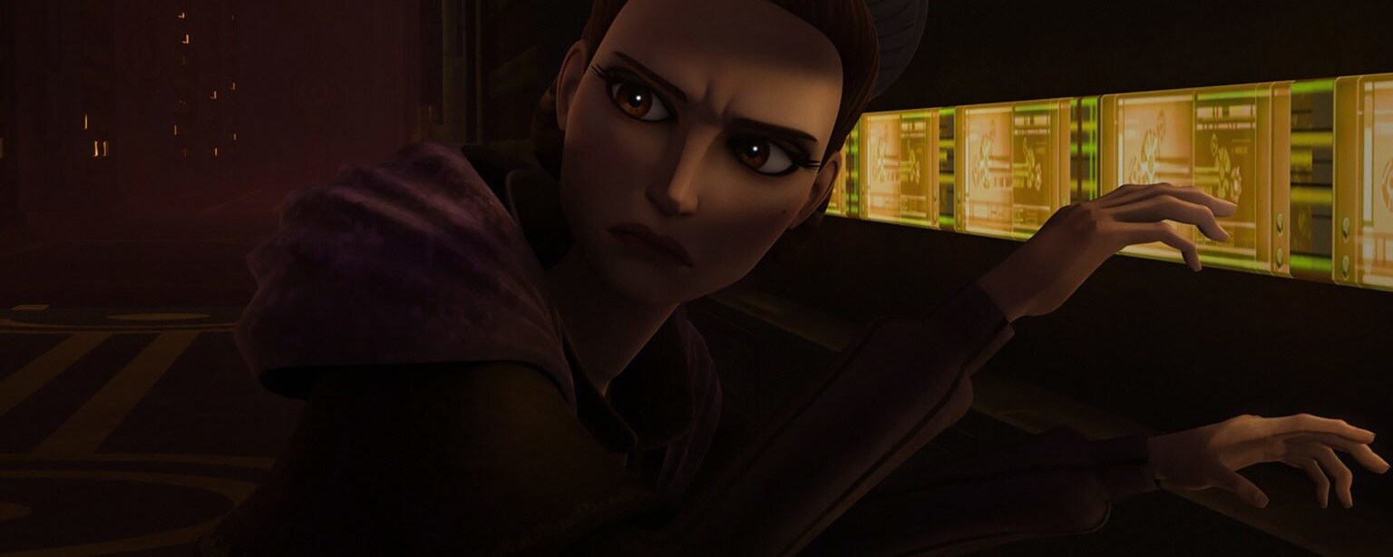 Padmé looks behind her while crouching in front of a computer panel in The Clone Wars.