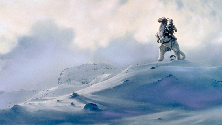 Luke Skywalker rides a tauntaun across the snowy landscape of Hoth.