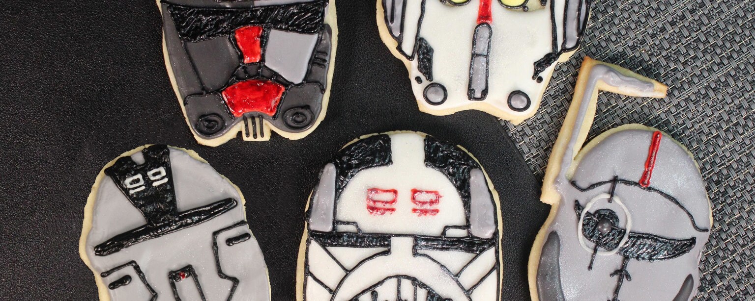 Cookies shaped and iced to look like the various helmets of the clone troopers from the animated series Star Wars: The Bad Batch.