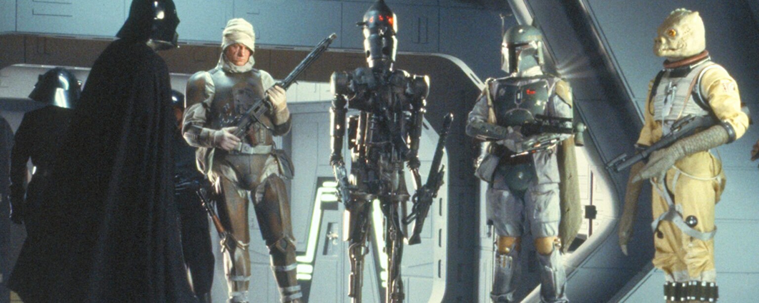 Bounty Hunters line up with Darth Vader.