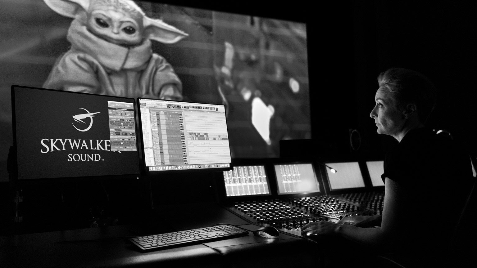 Sound designer at Skywalker Sound at work with Grogu on screen.