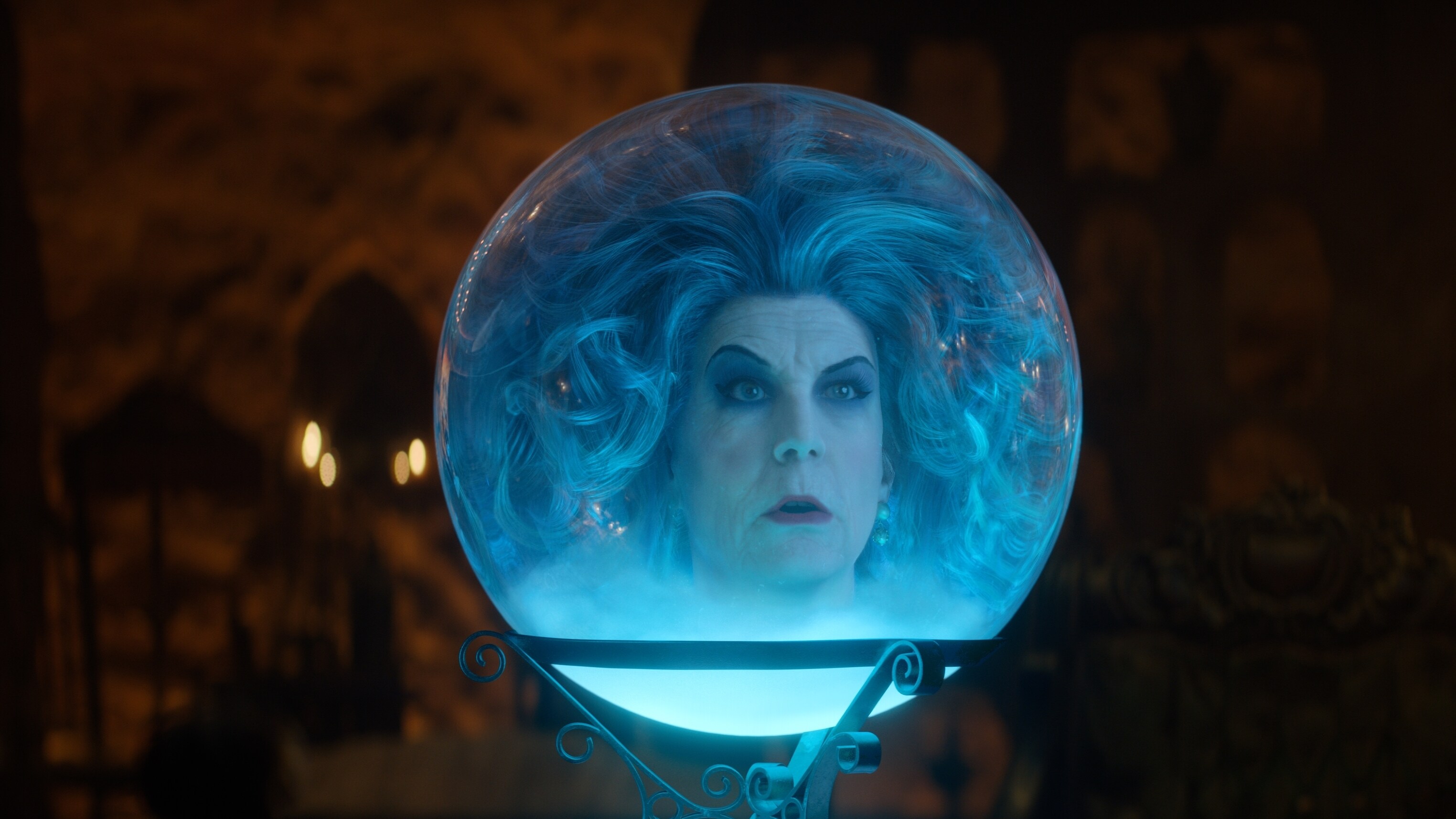 Film still of Madame Leota in a crystal ball