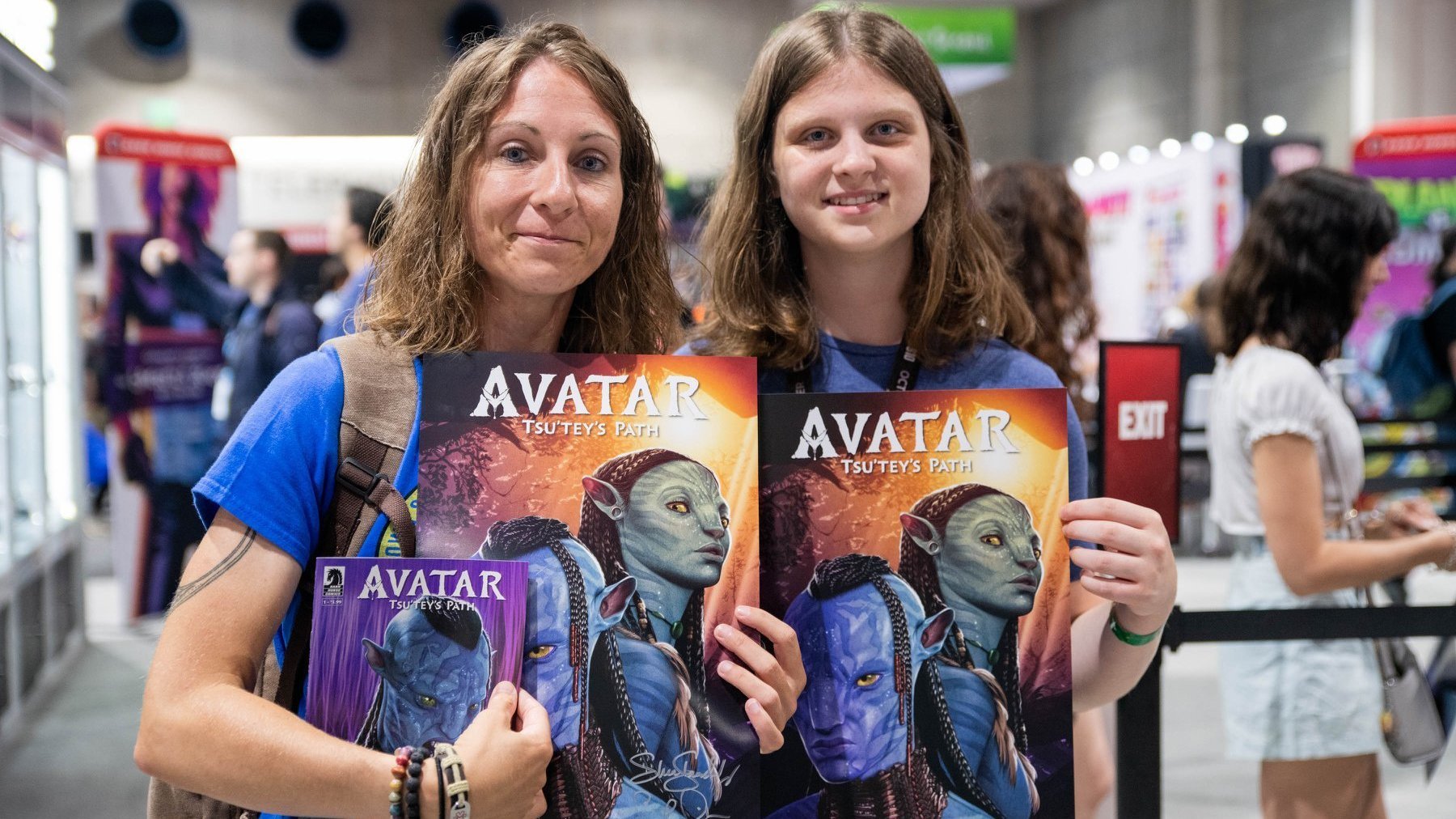 Avatar fans with their signed SDCC prints and comics