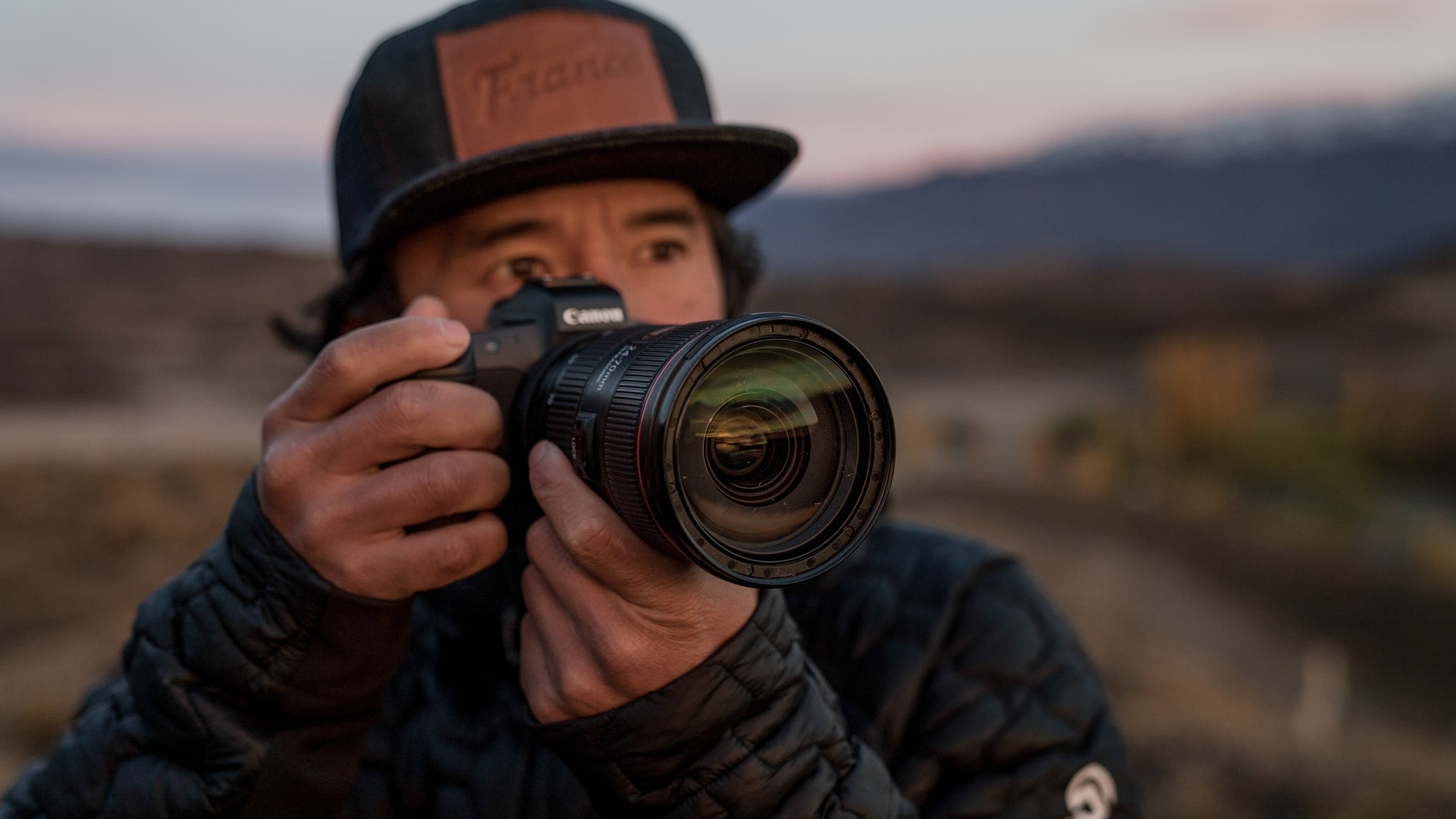 Jimmy Chin holding up his Canon DSLR. (Clair Popkin/National Geographic Documentary Films)