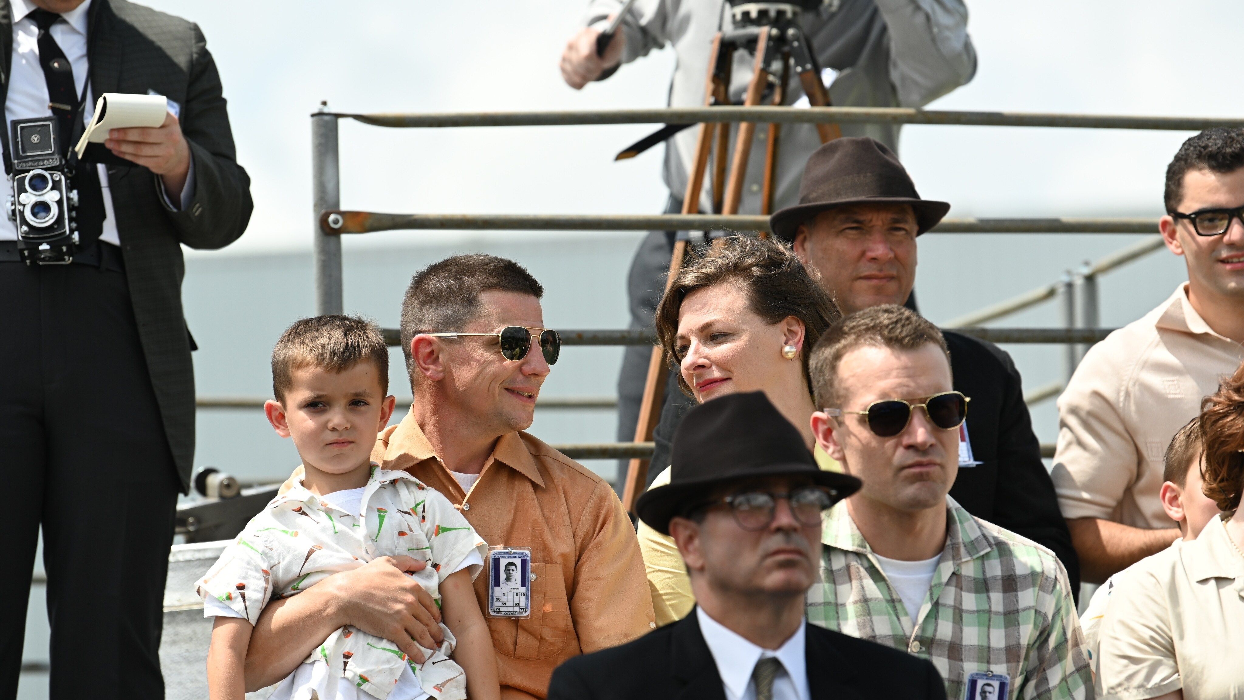 Gus Grissom played by Michael Trotter and Betty Grissom played by Rachel Buttram sit with their child watching the launch of a test rocket in National Geographic's THE RIGHT STUFF streaming on Disney+. (National Geographic/Gene Page)