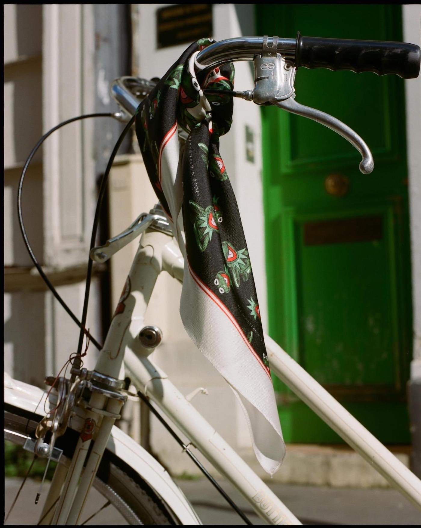 Black. white and red silk scarf featuring Kermit from the Sandro collection