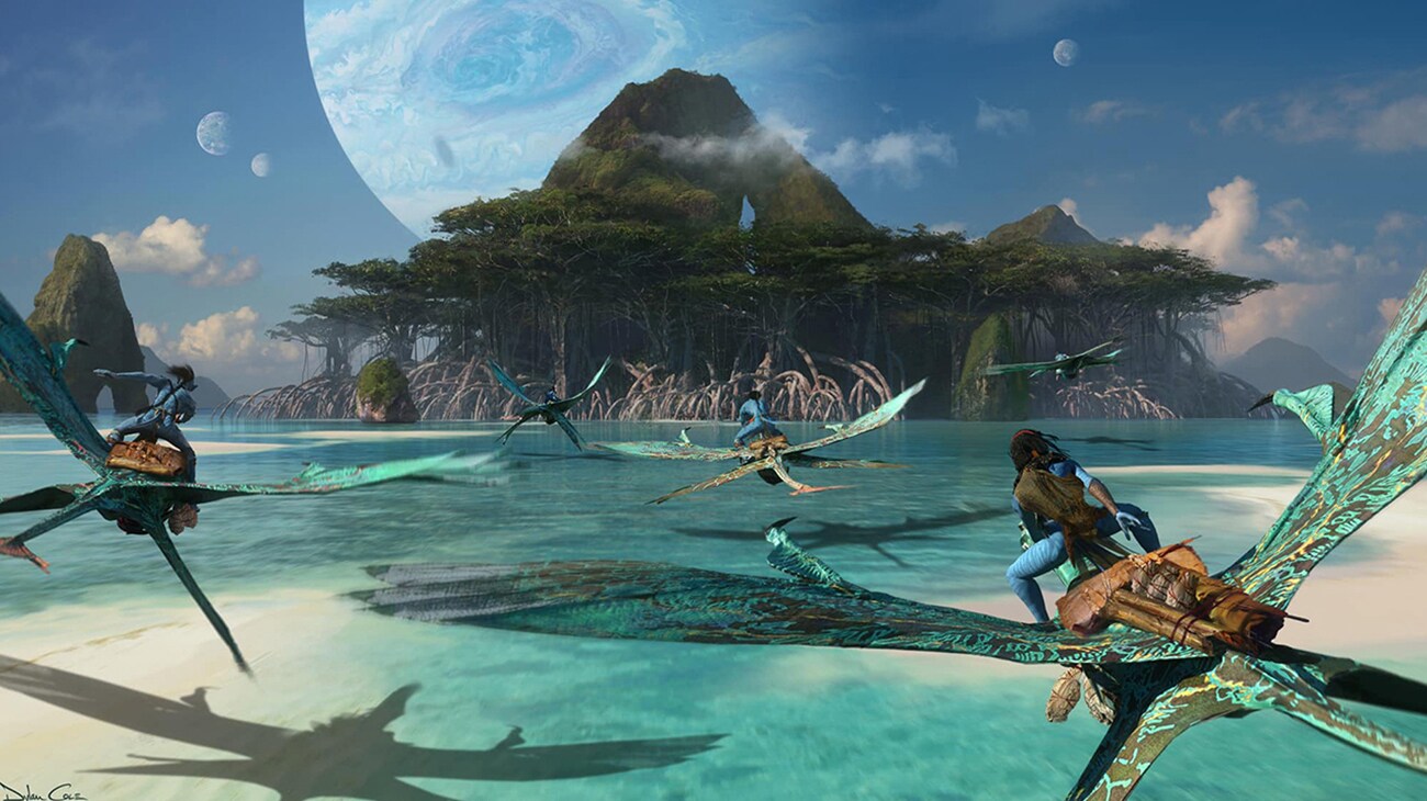 Image of a group of characters riding the flying creatures towards the rainforest from the 20th Century Studios movie Avatar: The Way of Water.