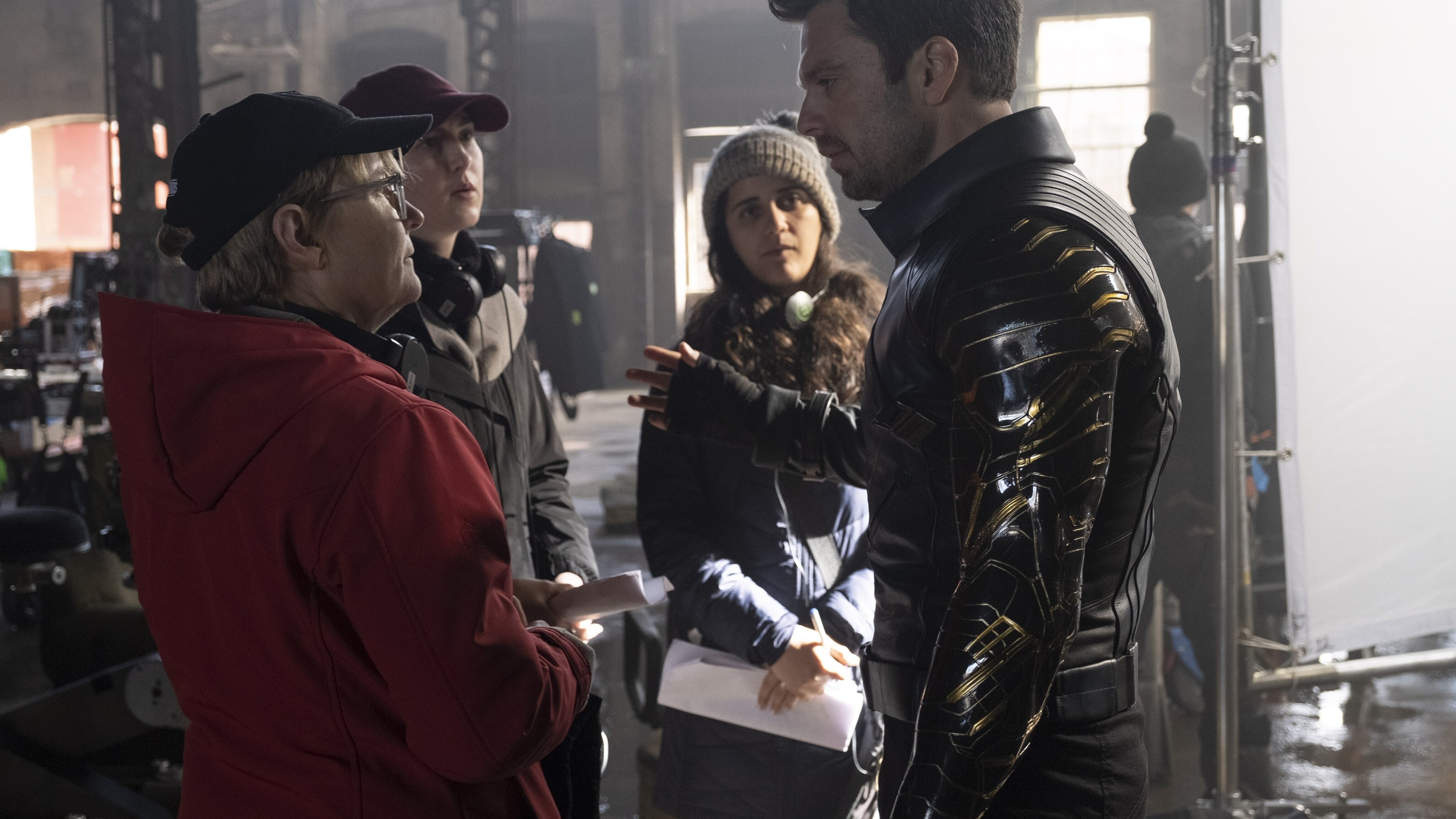 (L-R): Director Kari Skogland and Winter Soldier/Bucky Barnes (Sebastian Stan) on the set of Marvel Studios' THE FALCON AND THE WINTER SOLDIER exclusively on Disney+. Photo by Chuck Zlotnick. ©Marvel Studios 2021. All Rights Reserved.