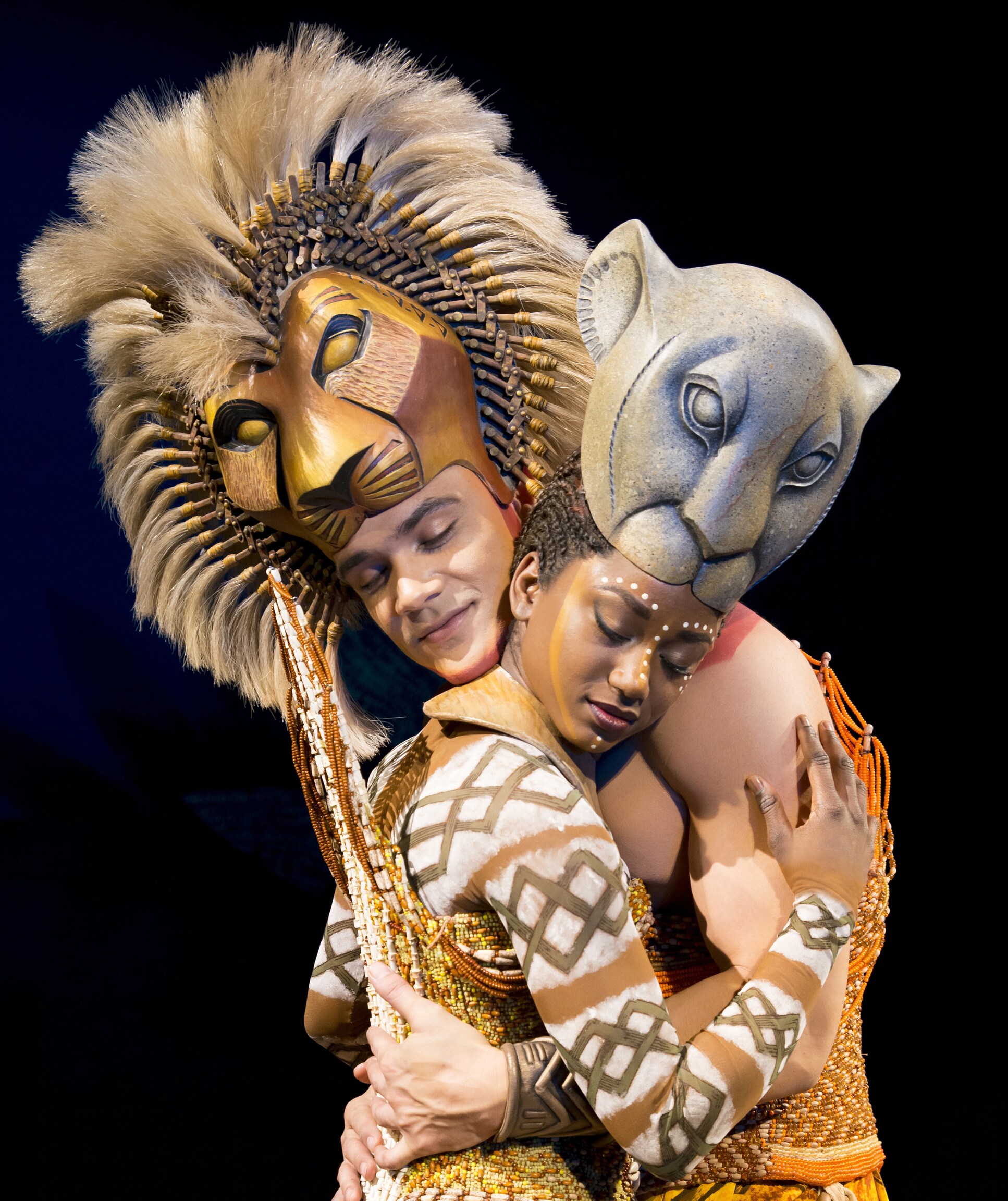 Janique Charles as Nala embracing Simba in The Lion King the Musical