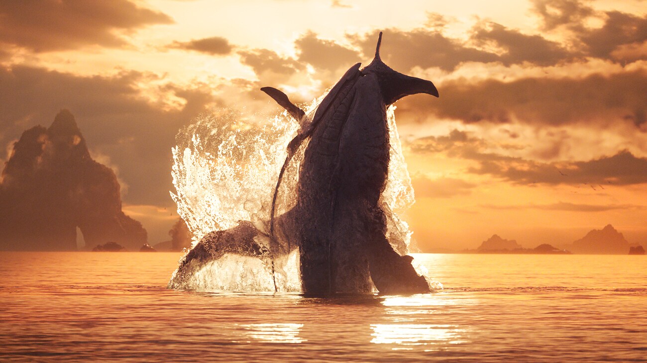 A tulkun breaches from the ocean during a sunset.