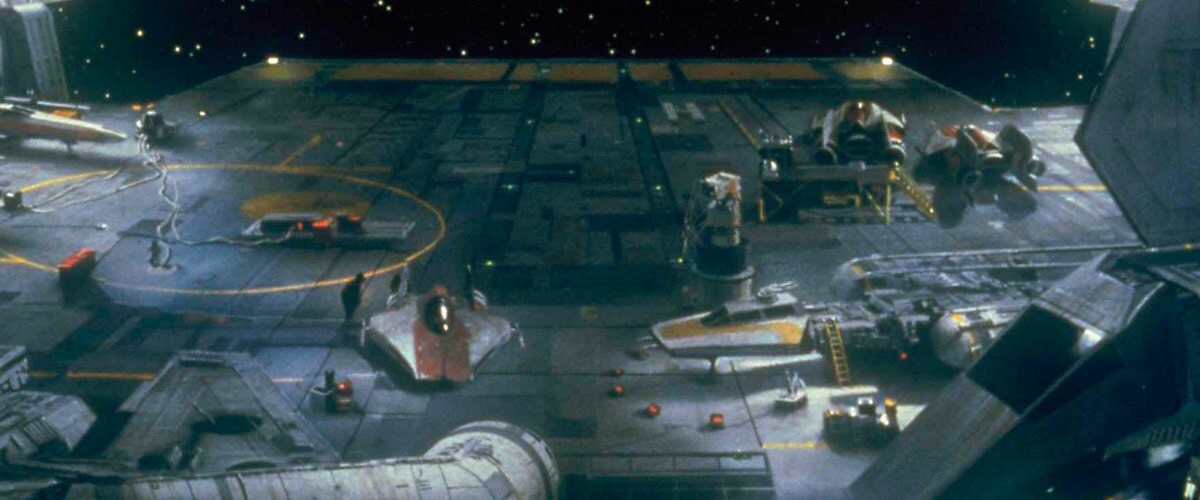 An A-Wing docked next to assorted Rebellion starfighters