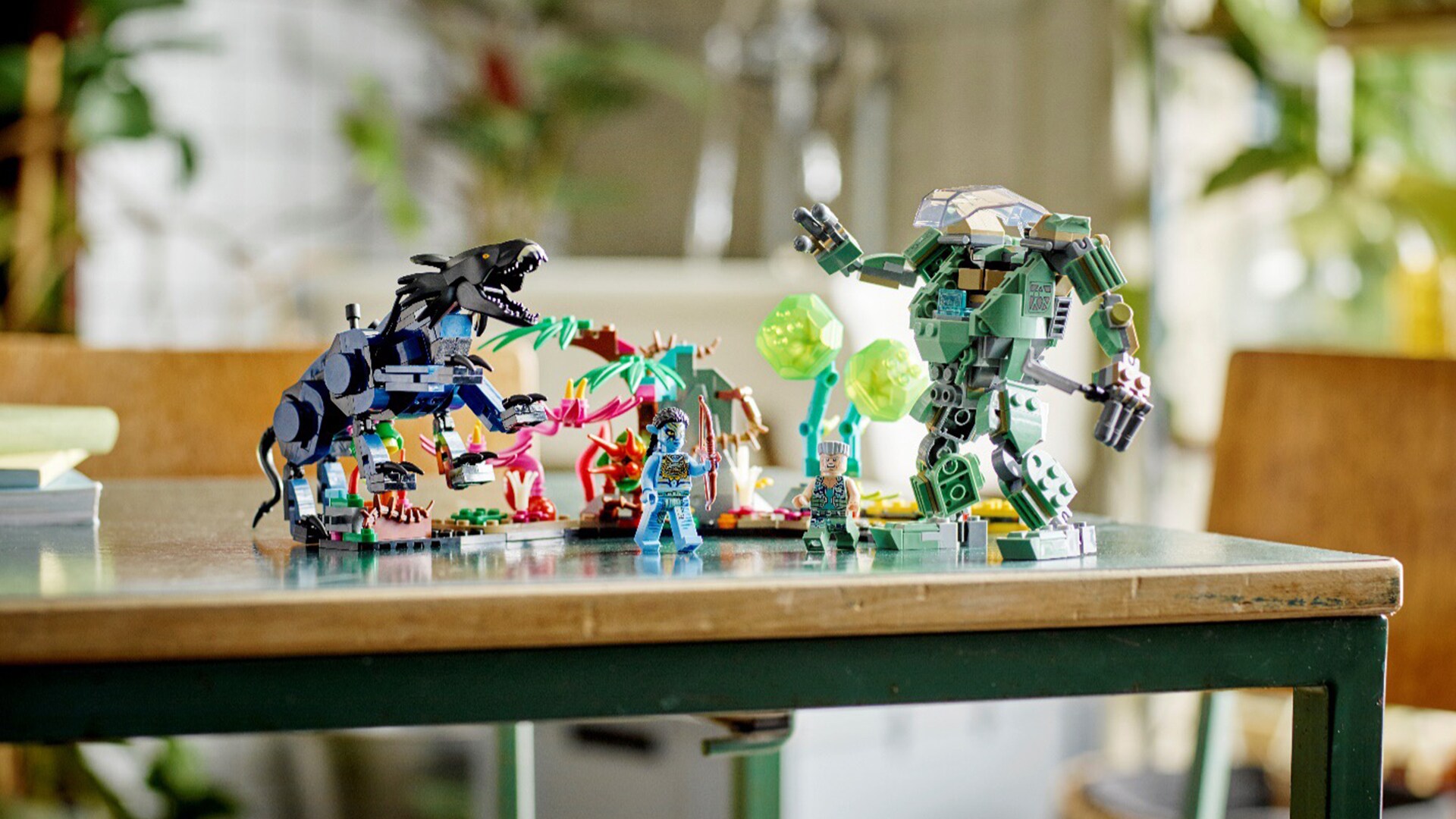 Image of LEGO Avatar Neytiri & Thanator vs. AMP Suit Quaritch set on the desk