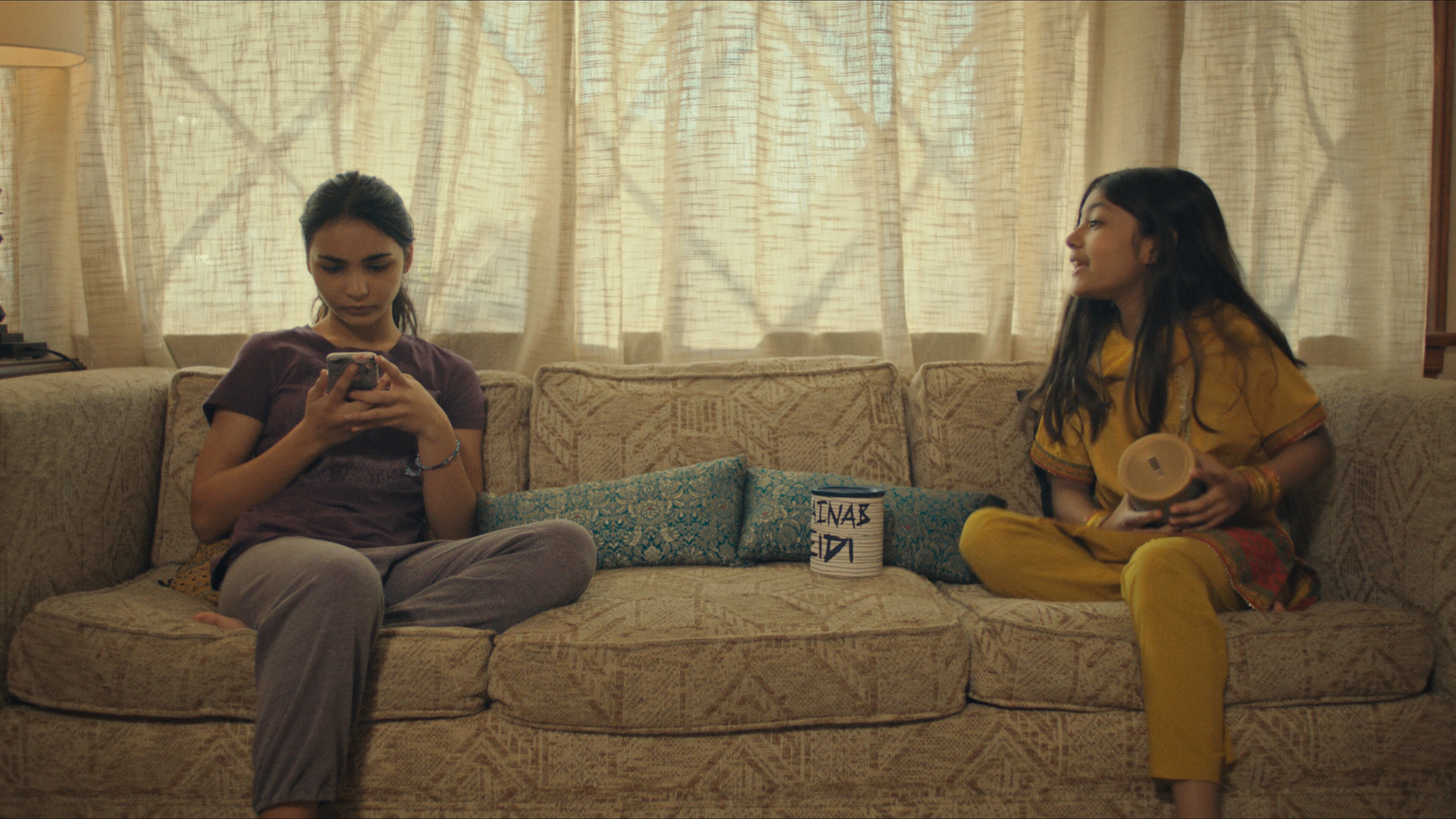 (L-R): Jenna Qureshi as Zainab and Shanessa Khawaja as Ameena in Disney’s “LAUNCHPAD” Season One short, “AMERICAN EID,” Written and Directed by Aqsa Altaf. Photo courtesy of Disney. © 2021 Disney Enterprises, Inc. All Rights Reserved.