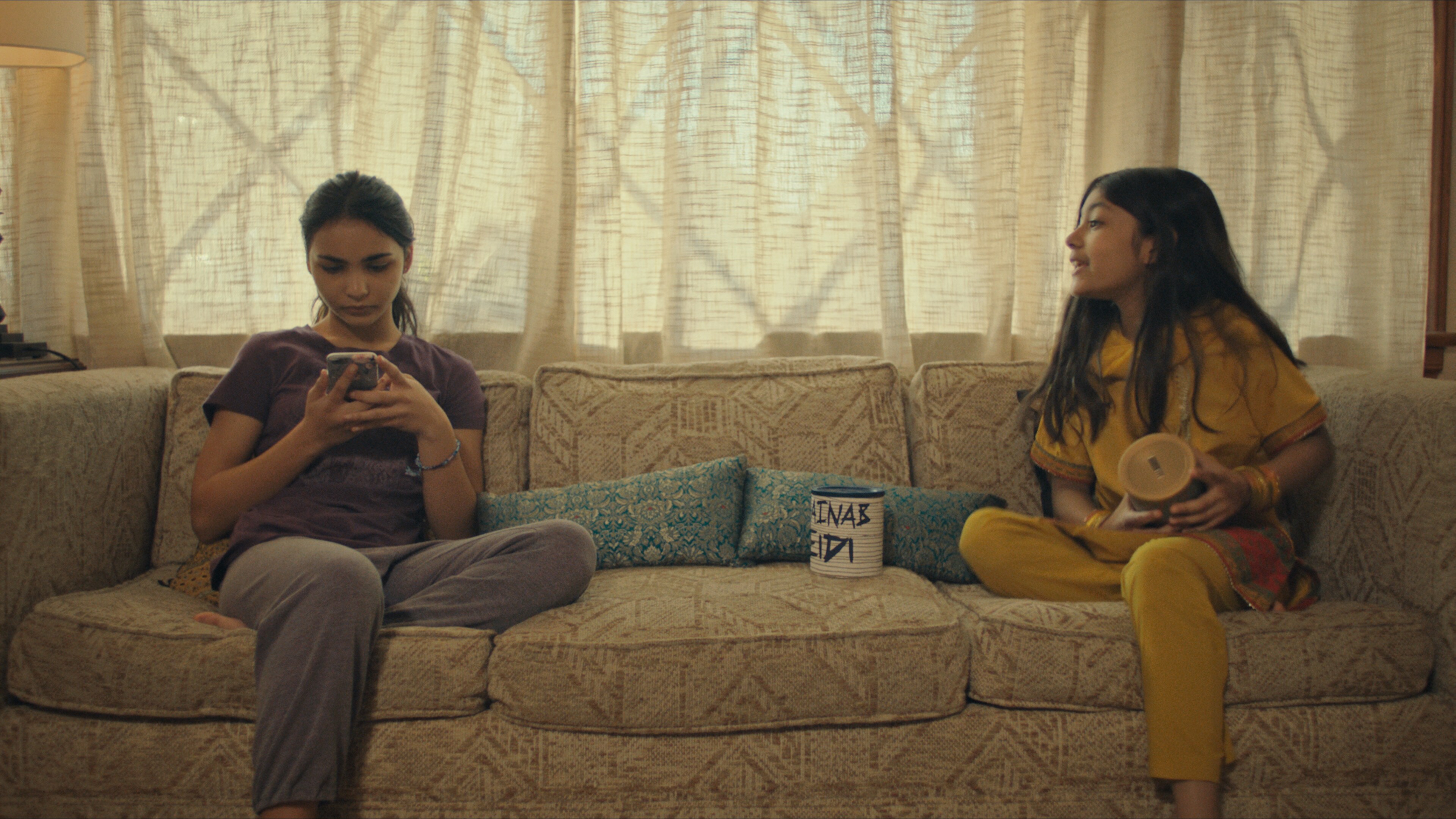 (L-R): Jenna Qureshi as Zainab and Shanessa Khawaja as Ameena in Disney’s “LAUNCHPAD” Season One short, “AMERICAN EID,” Written and Directed by Aqsa Altaf. Photo courtesy of Disney. © 2021 Disney Enterprises, Inc. All Rights Reserved.