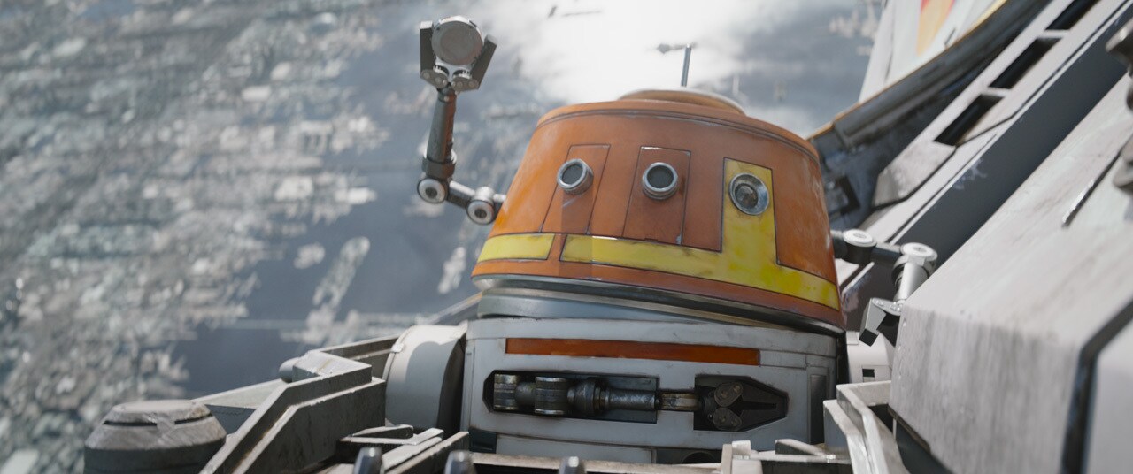 Chopper wings a tracking beacon onto the escaping craft with two astromech arms thrust in the air to celebrate his victory.