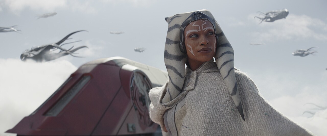 Ahsoka heads onto the wing of her shuttle and reaches out to a large purrgil.
