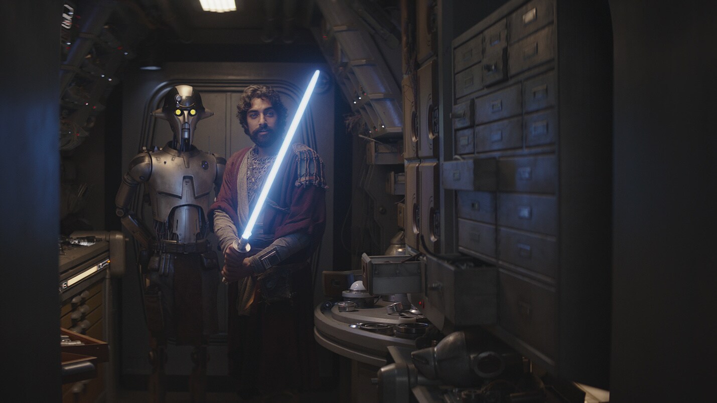 Ezra tinkers with his new lightsaber as Huyang advises, and asks the droid what happened between ...