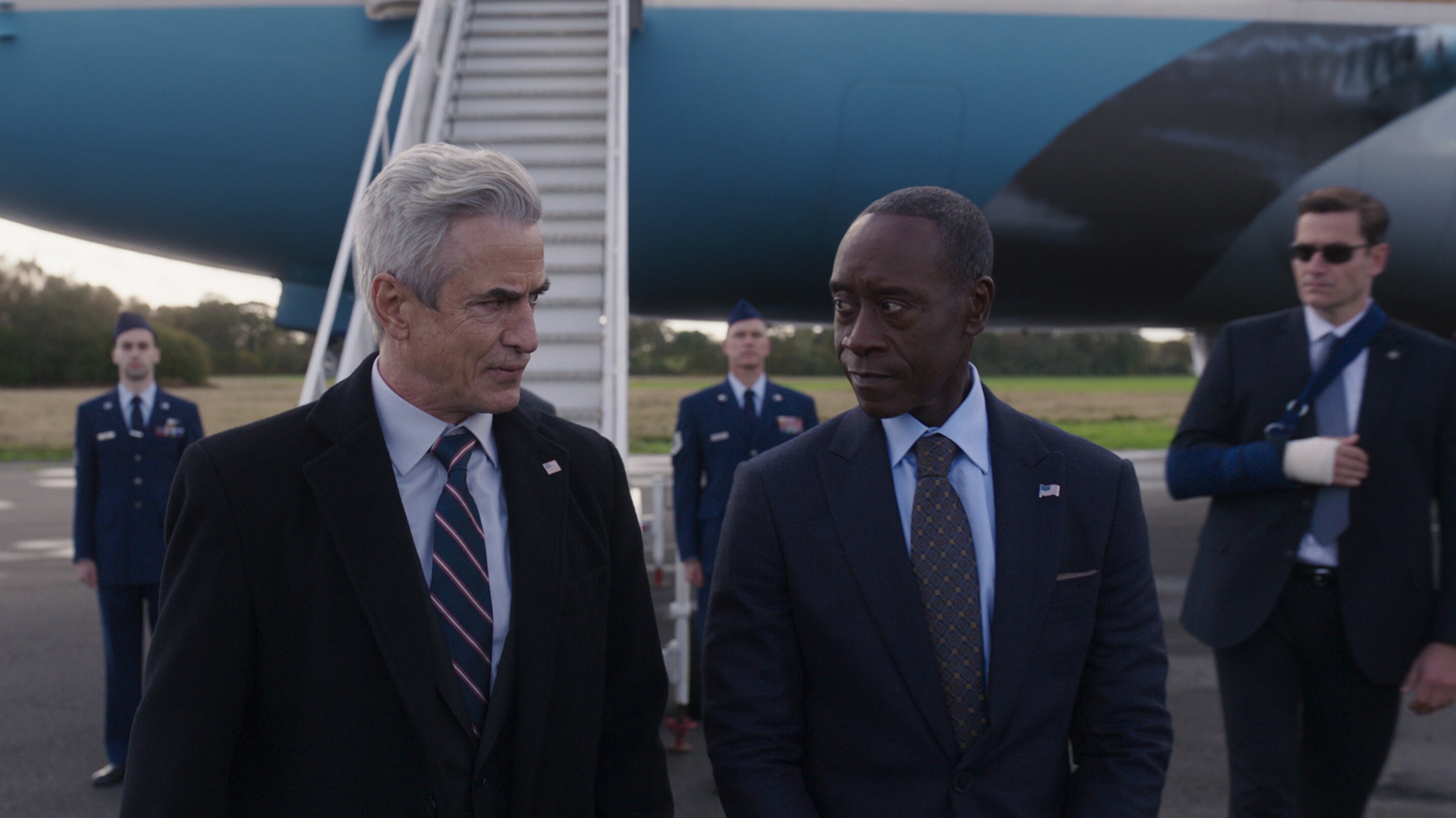 (L-R): Dermot Mulroney as President Ritson and Don Cheadle as James 'Rhodey' Rhodes in Marvel Studios' Secret Invasion, exclusively on Disney+. Photo courtesy of Marvel Studios. © 2023 MARVEL.