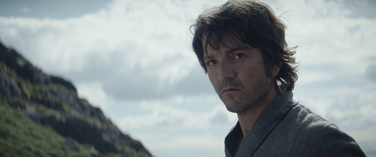Cassian Andor looking at the rebel on Aldhani
