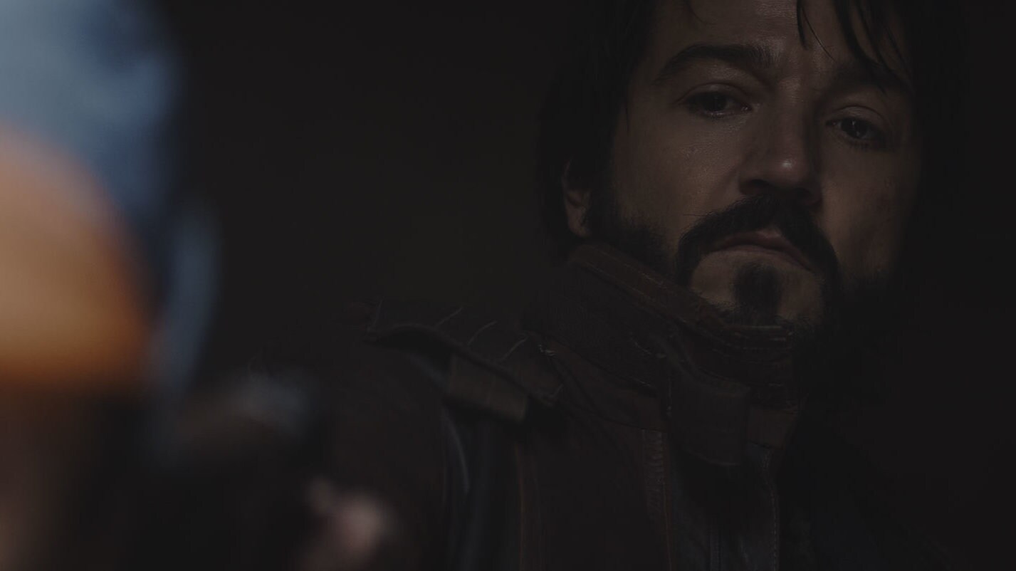 Cassian gets the jump on a visibly nervous Karn, and leaves him bound and gagged. Shortly after, ...