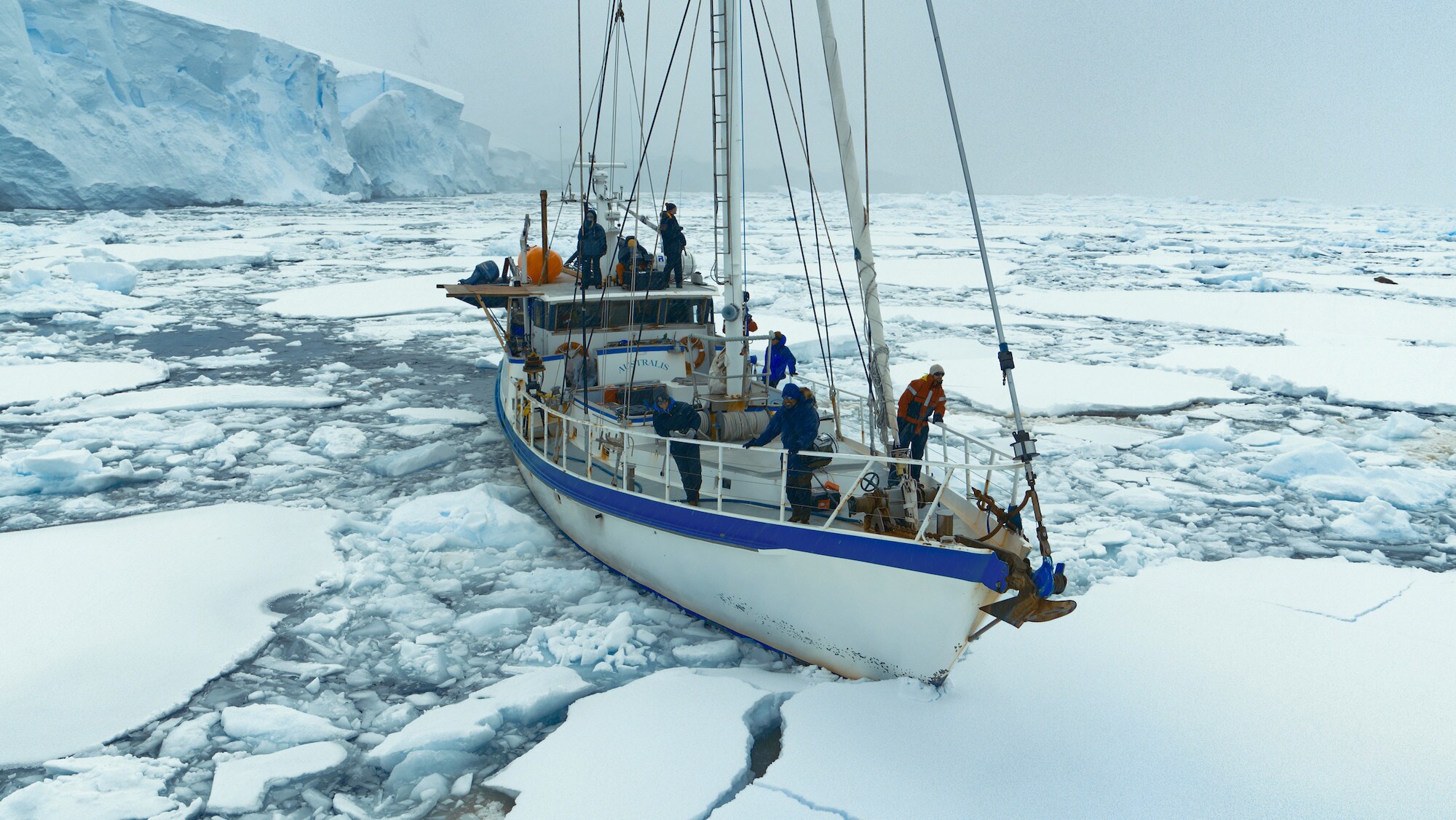 The crew onboard the Australis, heading through the ice sheets. (credit: National Geographic for Disney+/Bertie Gregory)