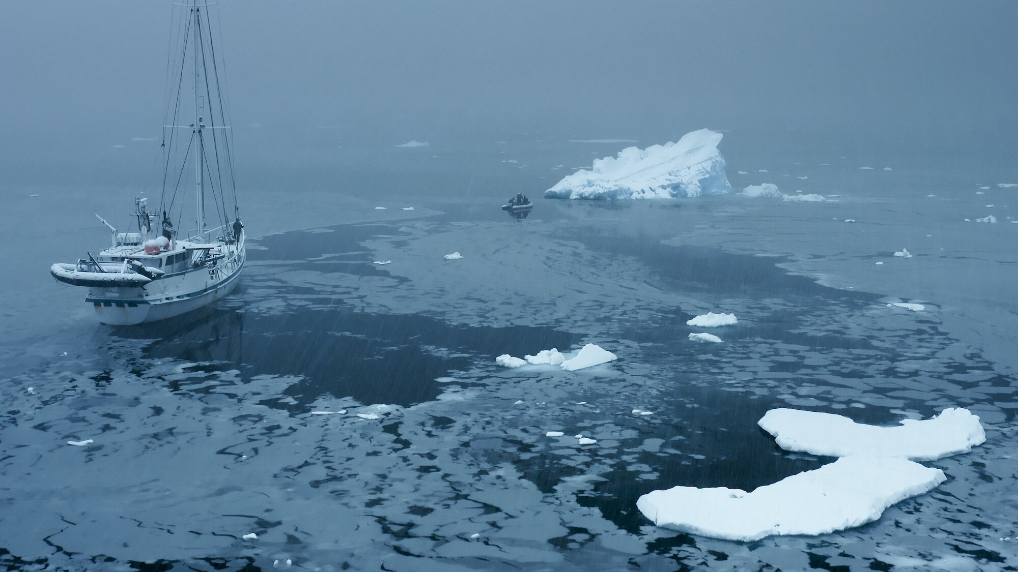 Film crew on the rib moving away from Australis and towards an iceberg. (credit: National Geographic for Disney+/Tom Walker)