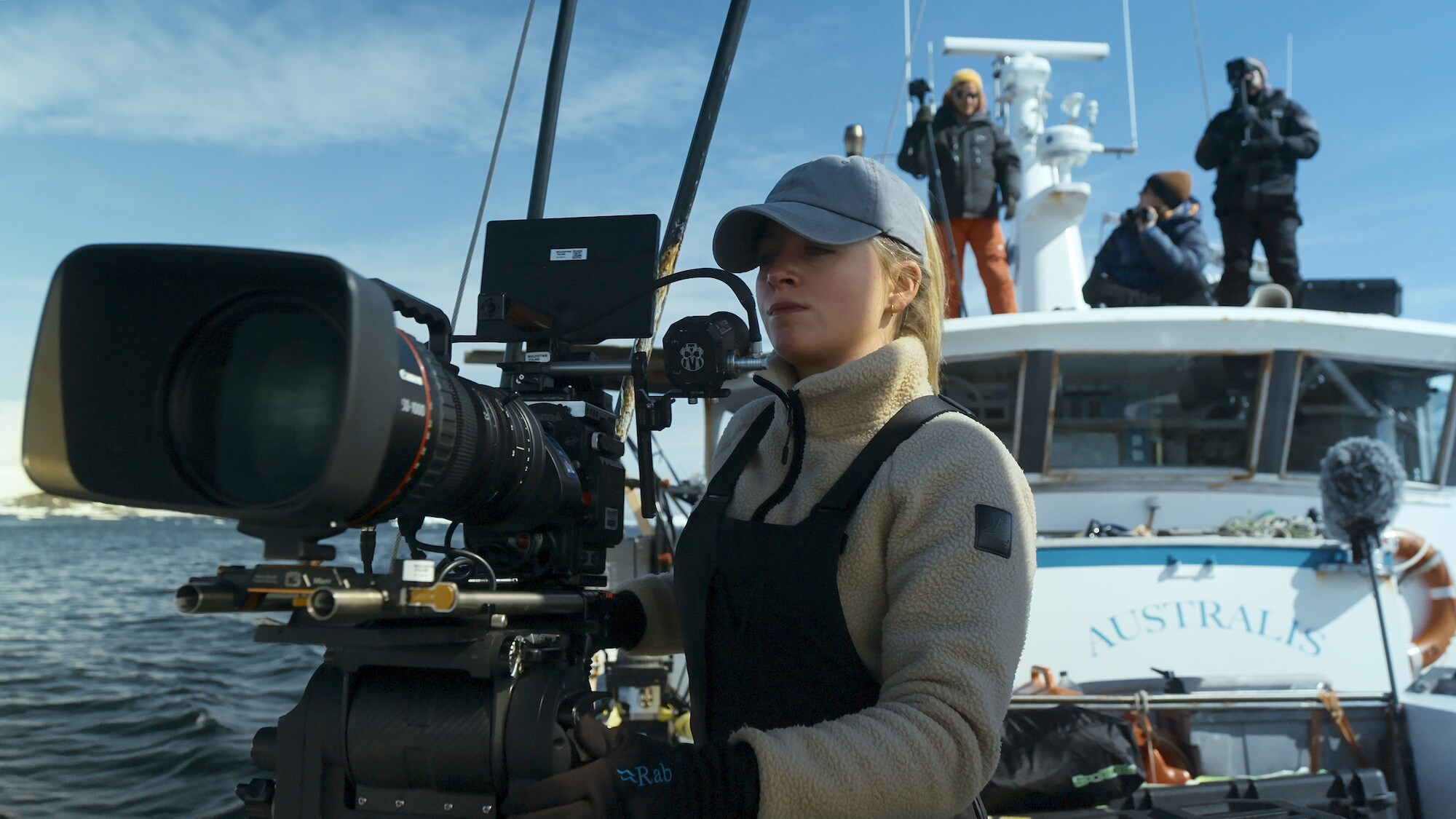 Anna Dimitriadis filming from the front of the Australis. (credit: National Geographic for Disney+/Will West)