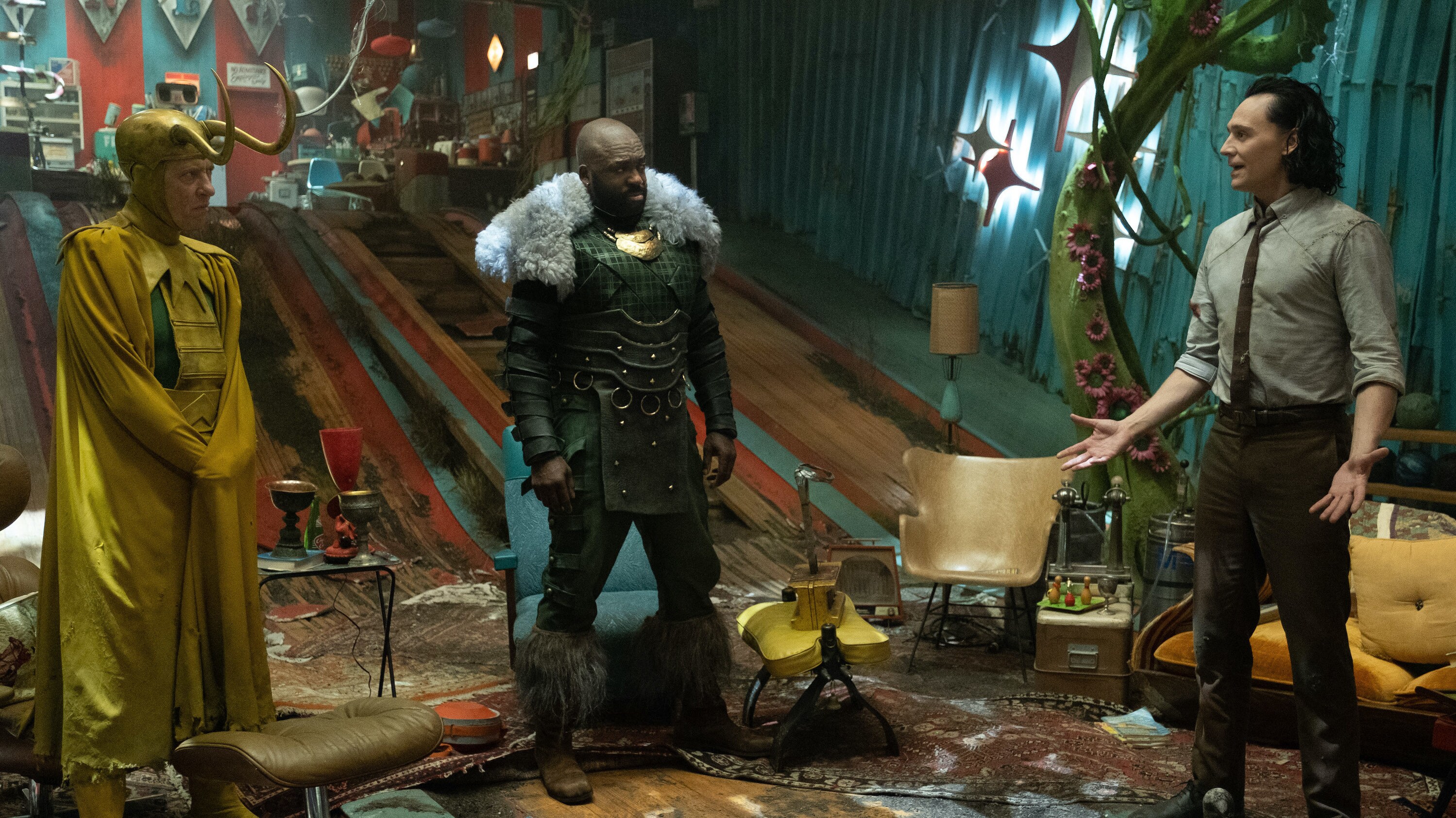 (L-R): Classic Loki (Richard E. Grant), Boastful Loki (DeObia Oparei) and Loki (Tom Hiddleston) in Marvel Studios' LOKI, exclusively on Disney+. Photo by Chuck Zlotnick. ©Marvel Studios 2021. All Rights Reserved.