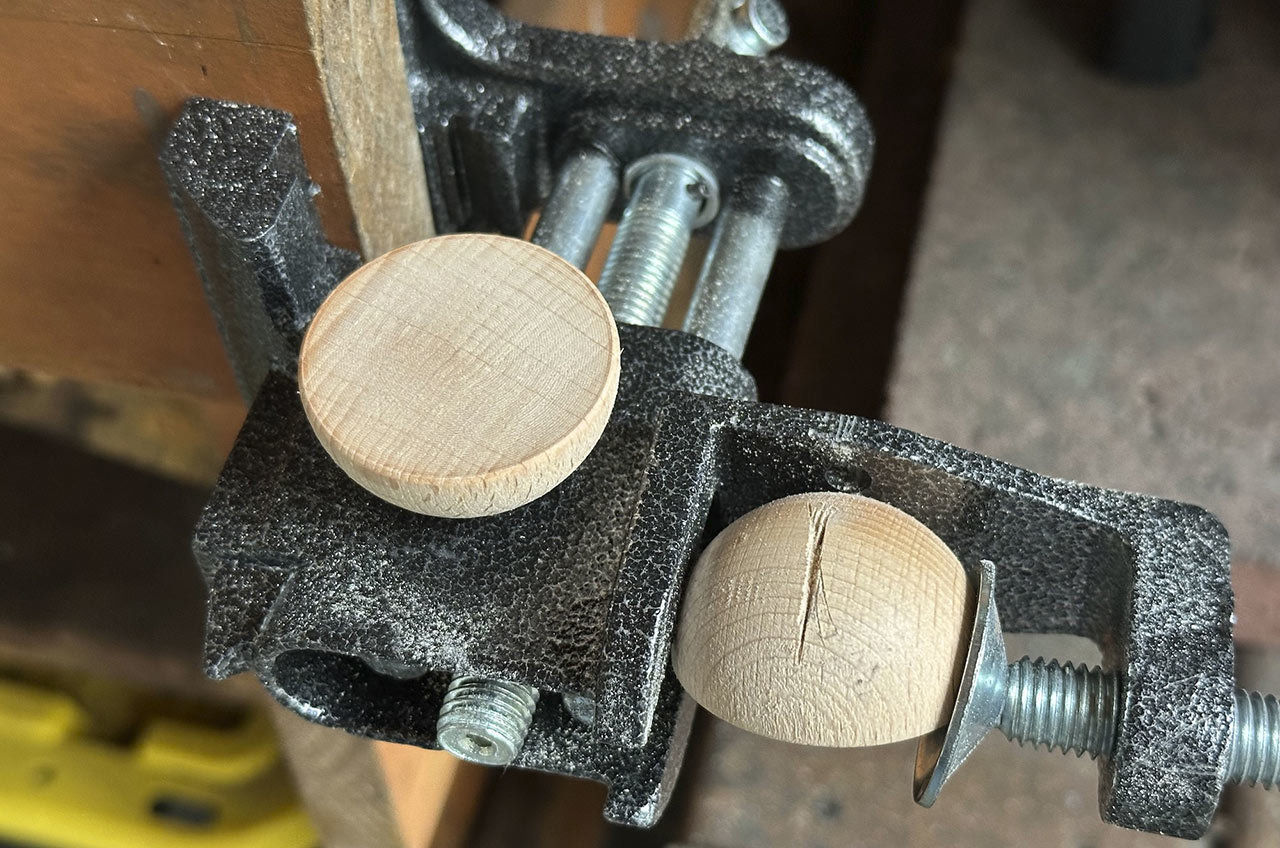 Step 8: While you’re using the saw, cut a notch in the back of the two half-spheres for the legs to slot in later. Set aside for now.