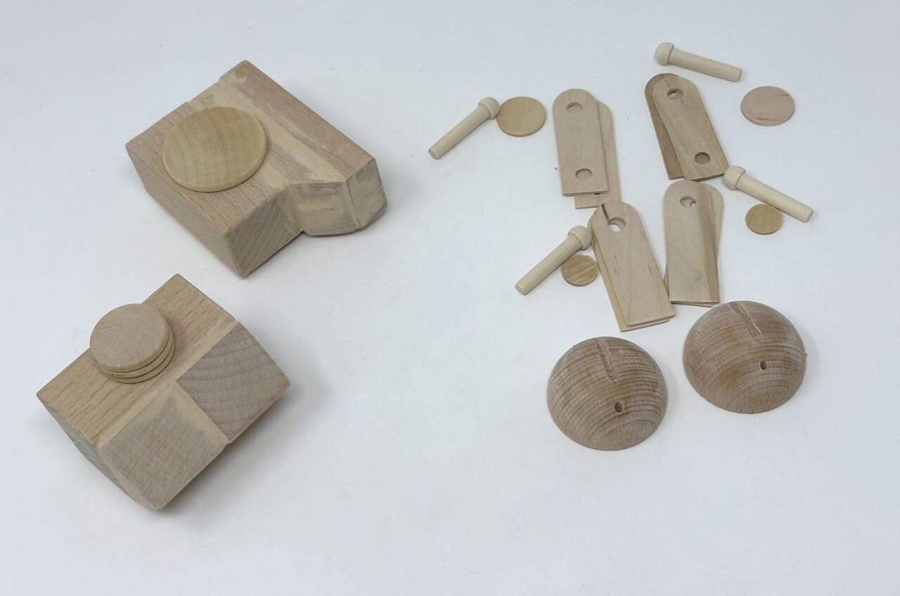 Step 14: Gather the 4 wood peg axles and 4 small wood discs for the legs so you can paint them in a moment.