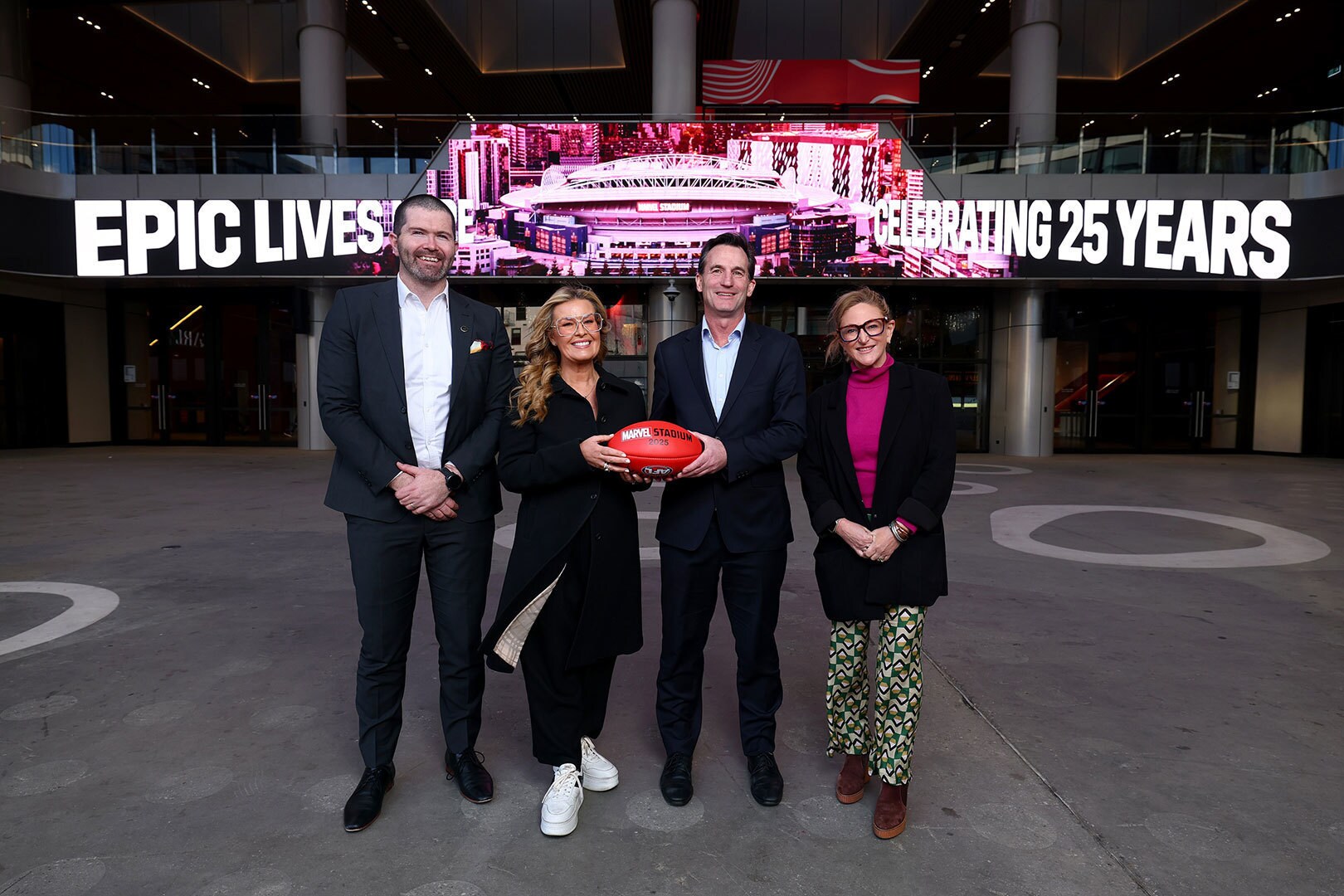 A photograph of Marvel Stadium General Manager Scott Fitzgerald, The Walt Disney Company Australia and New Zealand Senior Vice President and Managing Director, Kylie Watson-Wheeler, AFL CEO Andrew Dillon and AFL Executive General Manager Customer and Commercial, Bec Haagsma. Photo by Josh Chadwick/AFL Photos