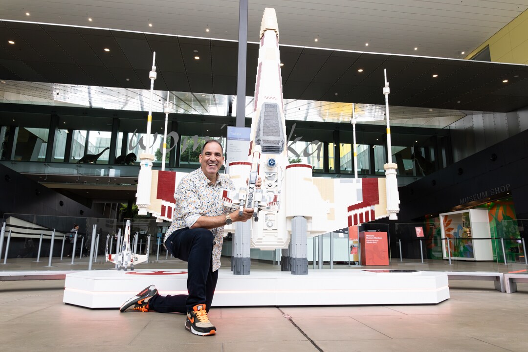 Ryan 'Brickman' McNaught in front of one of the items on display at the LEGO Star Wars Exhibition coming to Melbourne, Australia.