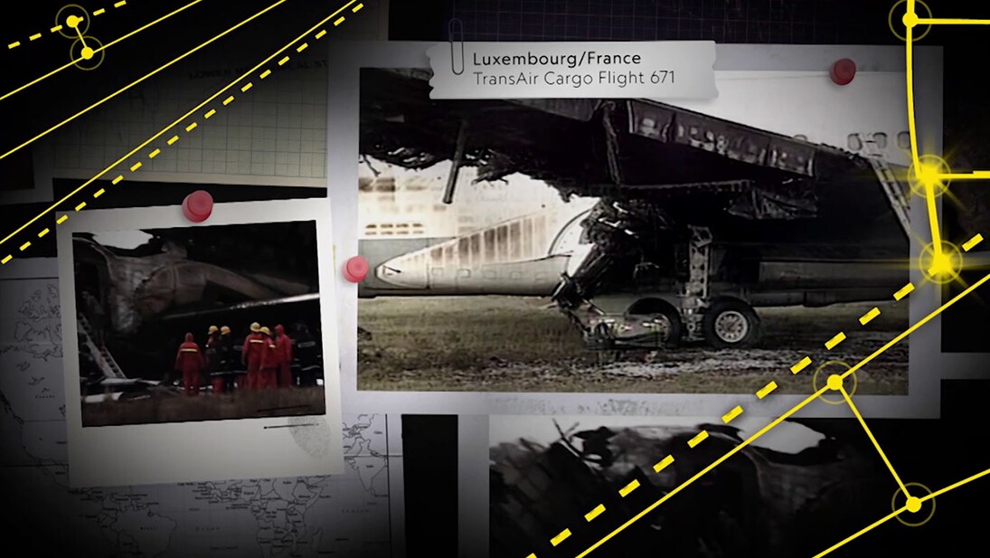 A pin board with photos of crashed planes and investigators