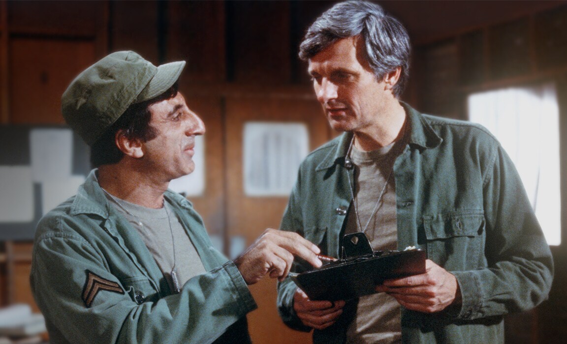 Jamie Farr and Alan Alda in M*A*S*H* on Disney Plus