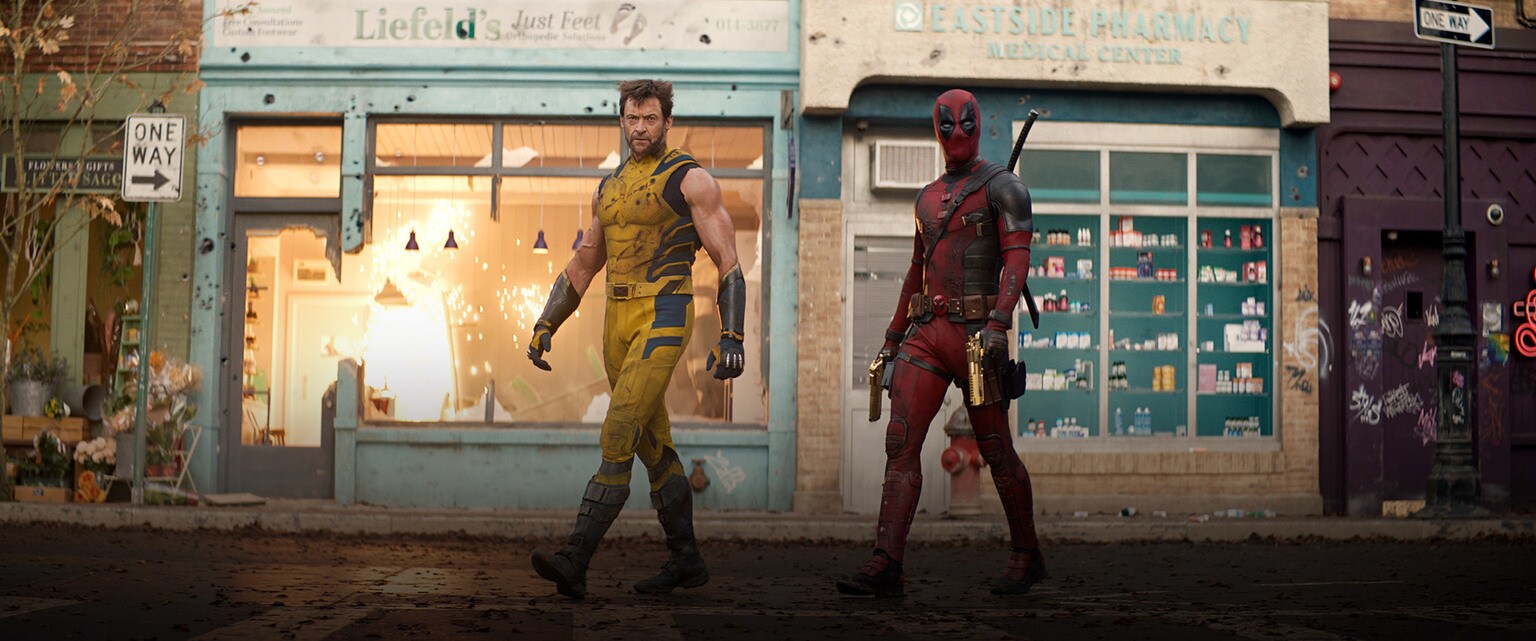 Promotional artwork for Marvel Studios' Deadpool and Wolverine featuring Hugh Jackman and Ryan Reynolds.