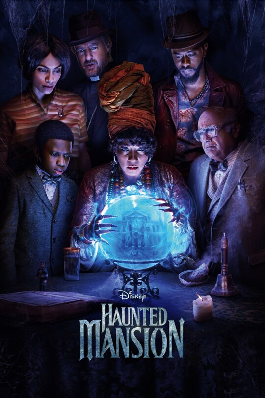Haunted Mansion movie poster with cast peering into a blue crystal orb.